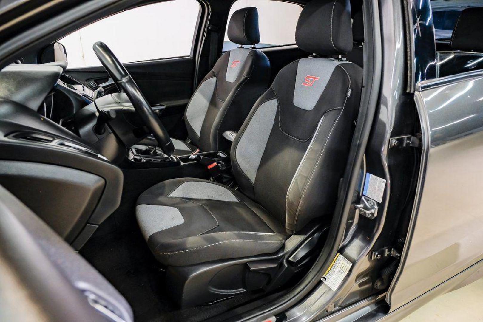 2015 Magnetic /Black Ford Focus ST (1FADP3L93FL) with an EcoBoost 2.0L I4 GTDi DOHC Turbocharged VCT engine, Manual transmission, located at 15300 Midway Rd., Addison, TX, 75001, (972) 702-0011, 32.958321, -96.838074 - 2015 Ford Focus ST<br><br>Now Available at Midway Auto Group, Addison, Texas<br><br>Sporty, aggressive, and built for enthusiasts the 2015 Ford Focus ST delivers turbocharged performance, sharp handling, and a driver-focused interior that sets it apart from traditional compact cars. With its signatu - Photo#37