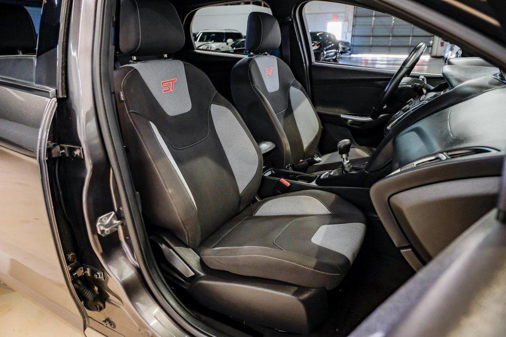 2015 Magnetic /Black Ford Focus ST (1FADP3L93FL) with an EcoBoost 2.0L I4 GTDi DOHC Turbocharged VCT engine, Manual transmission, located at 15300 Midway Rd., Addison, TX, 75001, (972) 702-0011, 32.958321, -96.838074 - 2015 Ford Focus ST<br><br>Now Available at Midway Auto Group, Addison, Texas<br><br>Sporty, aggressive, and built for enthusiasts the 2015 Ford Focus ST delivers turbocharged performance, sharp handling, and a driver-focused interior that sets it apart from traditional compact cars. With its signatu - Photo#39