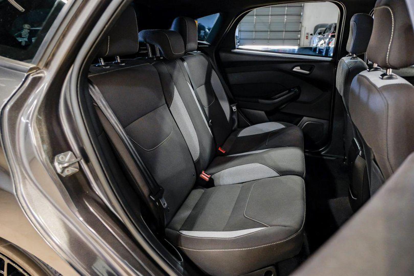 2015 Magnetic /Black Ford Focus ST (1FADP3L93FL) with an EcoBoost 2.0L I4 GTDi DOHC Turbocharged VCT engine, Manual transmission, located at 15300 Midway Rd., Addison, TX, 75001, (972) 702-0011, 32.958321, -96.838074 - 2015 Ford Focus ST<br><br>Now Available at Midway Auto Group, Addison, Texas<br><br>Sporty, aggressive, and built for enthusiasts the 2015 Ford Focus ST delivers turbocharged performance, sharp handling, and a driver-focused interior that sets it apart from traditional compact cars. With its signatu - Photo#40