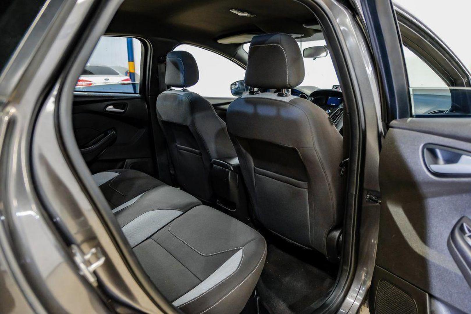 2015 Magnetic /Black Ford Focus ST (1FADP3L93FL) with an EcoBoost 2.0L I4 GTDi DOHC Turbocharged VCT engine, Manual transmission, located at 15300 Midway Rd., Addison, TX, 75001, (972) 702-0011, 32.958321, -96.838074 - 2015 Ford Focus ST<br><br>Now Available at Midway Auto Group, Addison, Texas<br><br>Sporty, aggressive, and built for enthusiasts the 2015 Ford Focus ST delivers turbocharged performance, sharp handling, and a driver-focused interior that sets it apart from traditional compact cars. With its signatu - Photo#41