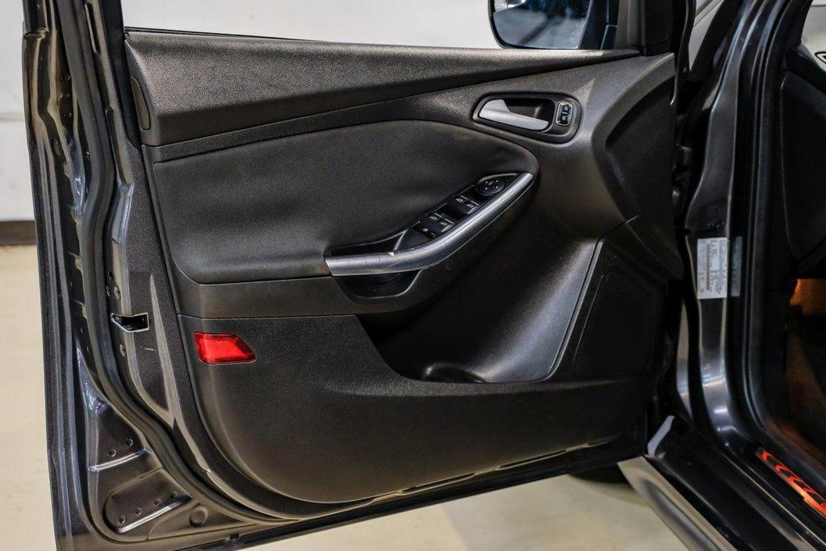 2015 Magnetic /Black Ford Focus ST (1FADP3L93FL) with an EcoBoost 2.0L I4 GTDi DOHC Turbocharged VCT engine, Manual transmission, located at 15300 Midway Rd., Addison, TX, 75001, (972) 702-0011, 32.958321, -96.838074 - 2015 Ford Focus ST<br><br>Now Available at Midway Auto Group, Addison, Texas<br><br>Sporty, aggressive, and built for enthusiasts the 2015 Ford Focus ST delivers turbocharged performance, sharp handling, and a driver-focused interior that sets it apart from traditional compact cars. With its signatu - Photo#46