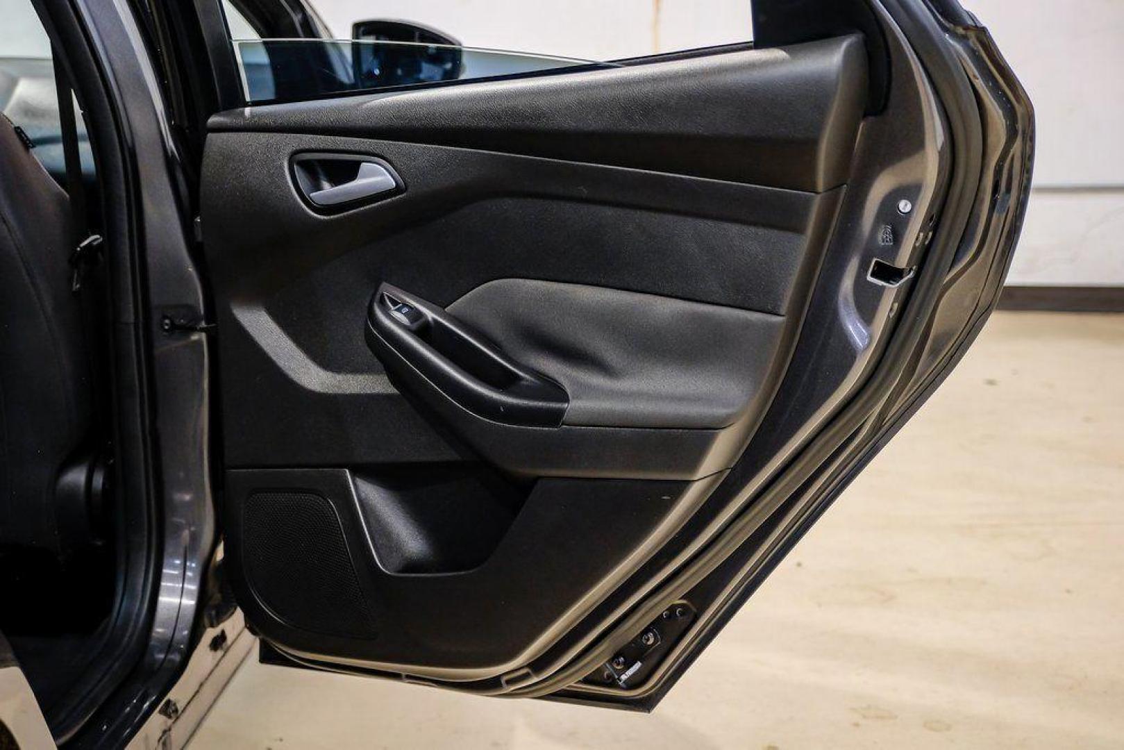 2015 Magnetic /Black Ford Focus ST (1FADP3L93FL) with an EcoBoost 2.0L I4 GTDi DOHC Turbocharged VCT engine, Manual transmission, located at 15300 Midway Rd., Addison, TX, 75001, (972) 702-0011, 32.958321, -96.838074 - 2015 Ford Focus ST<br><br>Now Available at Midway Auto Group, Addison, Texas<br><br>Sporty, aggressive, and built for enthusiasts the 2015 Ford Focus ST delivers turbocharged performance, sharp handling, and a driver-focused interior that sets it apart from traditional compact cars. With its signatu - Photo#50