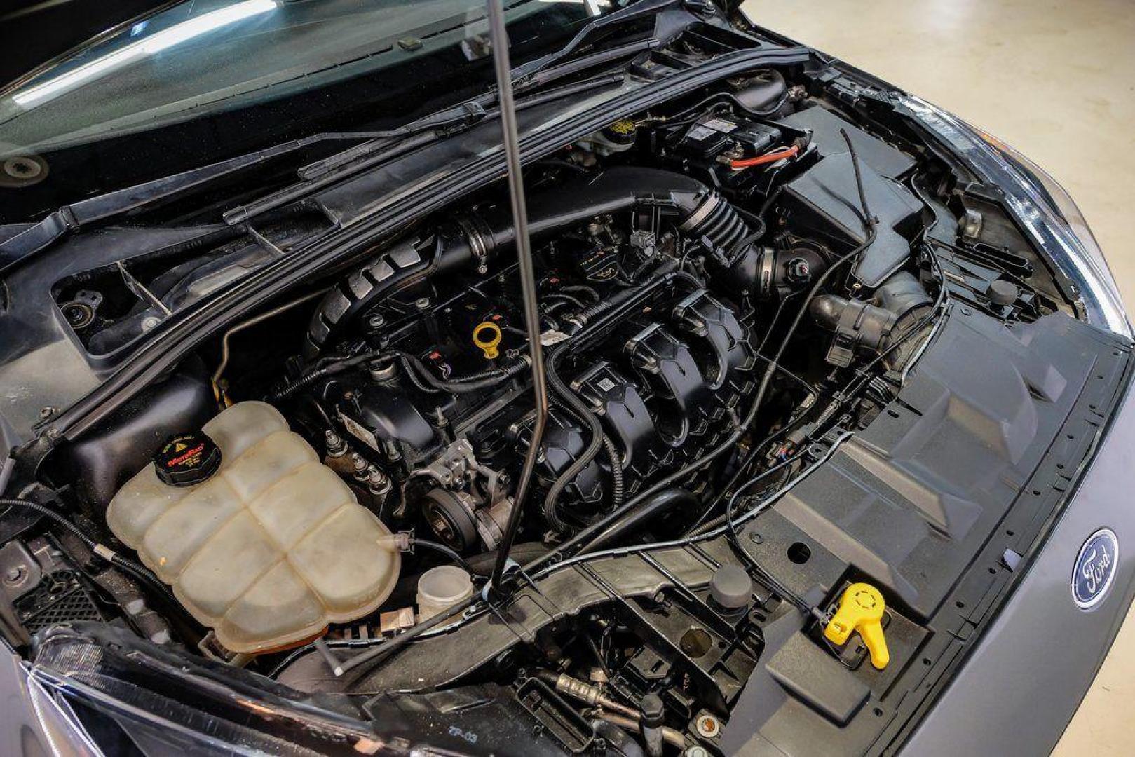 2015 Magnetic /Black Ford Focus ST (1FADP3L93FL) with an EcoBoost 2.0L I4 GTDi DOHC Turbocharged VCT engine, Manual transmission, located at 15300 Midway Rd., Addison, TX, 75001, (972) 702-0011, 32.958321, -96.838074 - 2015 Ford Focus ST<br><br>Now Available at Midway Auto Group, Addison, Texas<br><br>Sporty, aggressive, and built for enthusiasts the 2015 Ford Focus ST delivers turbocharged performance, sharp handling, and a driver-focused interior that sets it apart from traditional compact cars. With its signatu - Photo#55