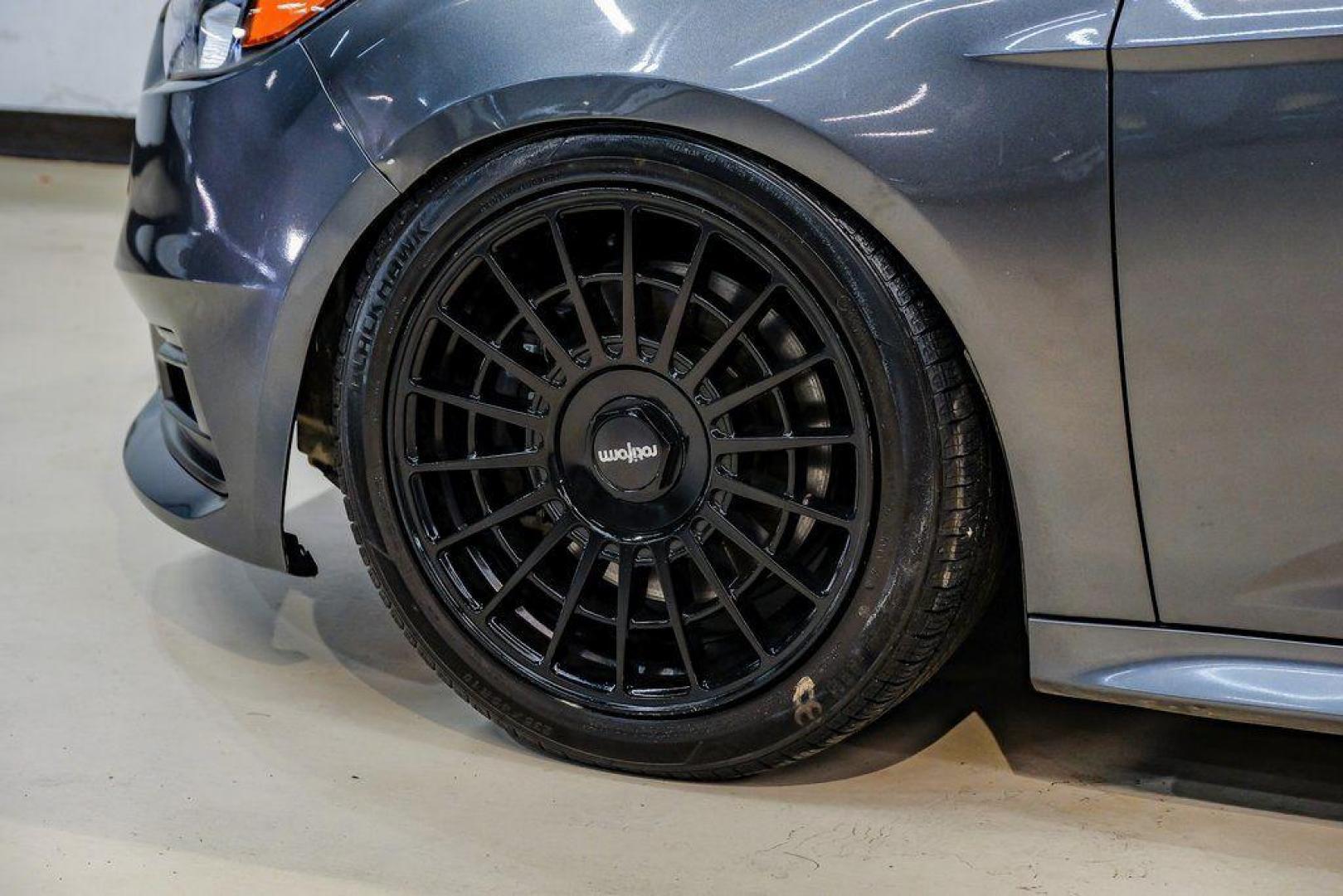 2015 Magnetic /Black Ford Focus ST (1FADP3L93FL) with an EcoBoost 2.0L I4 GTDi DOHC Turbocharged VCT engine, Manual transmission, located at 15300 Midway Rd., Addison, TX, 75001, (972) 702-0011, 32.958321, -96.838074 - 2015 Ford Focus ST<br><br>Now Available at Midway Auto Group, Addison, Texas<br><br>Sporty, aggressive, and built for enthusiasts the 2015 Ford Focus ST delivers turbocharged performance, sharp handling, and a driver-focused interior that sets it apart from traditional compact cars. With its signatu - Photo#60