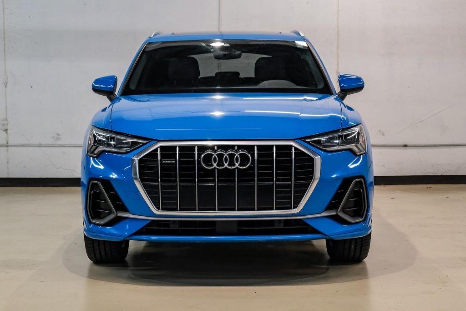 2020 Blue /Rotor Gray W/Anthracite Audi Q3 Premium Plus S line (WA1EEDF37L1) with an 2.0L 4-Cylinder TFSI engine, Automatic transmission, located at 15300 Midway Rd., Addison, TX, 75001, (972) 702-0011, 32.958321, -96.838074 - 020 Audi Q3 S line Premium Plus Quattro<br><br>Now Available at Midway Auto Group, Addison, Texas<br><br>Stylish, compact, and packed with premium features the 2020 Audi Q3 S line Premium Plus Quattro delivers upscale comfort and confident performance in a versatile small SUV. With its S line exteri- Photo#5