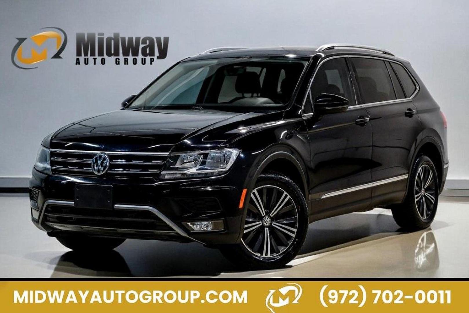 2019 Deep Black /Golden Oak and Black Volkswagen Tiguan 2.0T SEL (3VV3B7AX4KM) with an 2.0L TSI DOHC engine, Automatic transmission, located at 15300 Midway Rd., Addison, TX, 75001, (972) 702-0011, 32.958321, -96.838074 - Photo#0