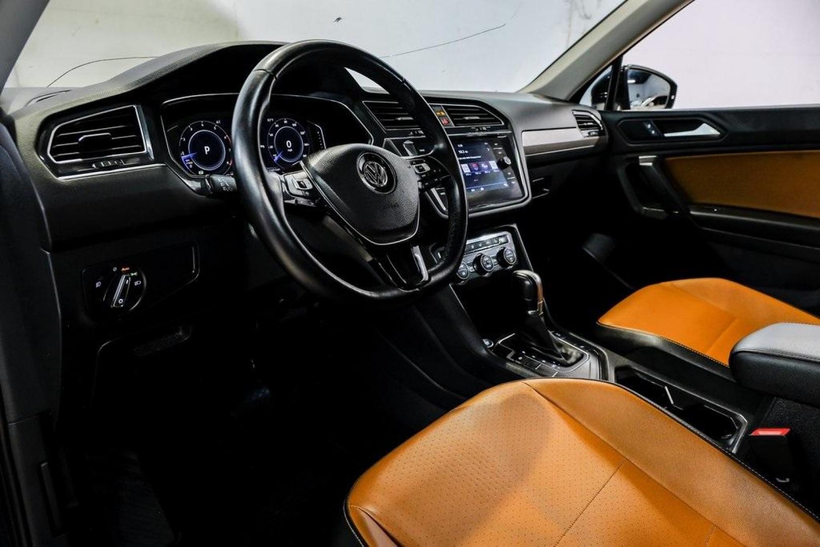 2019 Deep Black /Golden Oak and Black Volkswagen Tiguan 2.0T SEL (3VV3B7AX4KM) with an 2.0L TSI DOHC engine, Automatic transmission, located at 15300 Midway Rd., Addison, TX, 75001, (972) 702-0011, 32.958321, -96.838074 - Photo#2