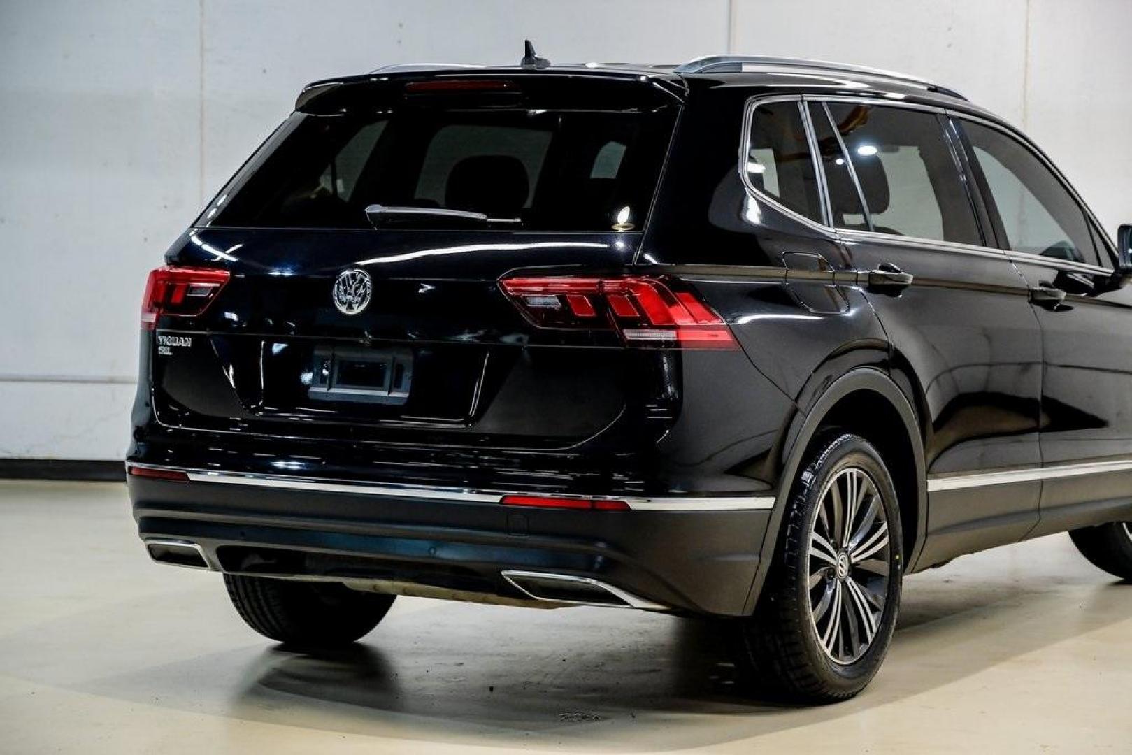 2019 Deep Black /Golden Oak and Black Volkswagen Tiguan 2.0T SEL (3VV3B7AX4KM) with an 2.0L TSI DOHC engine, Automatic transmission, located at 15300 Midway Rd., Addison, TX, 75001, (972) 702-0011, 32.958321, -96.838074 - Photo#11