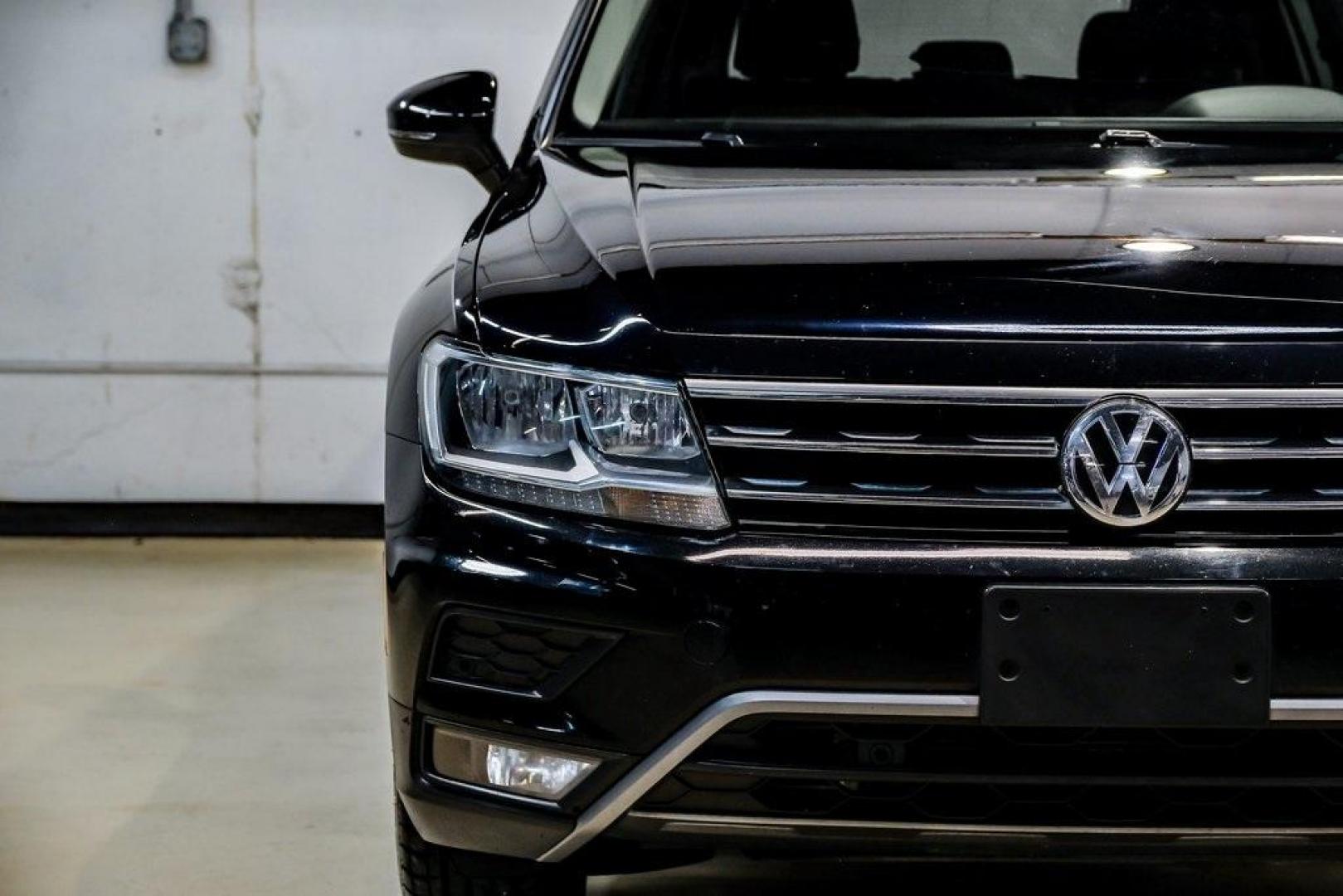 2019 Deep Black /Golden Oak and Black Volkswagen Tiguan 2.0T SEL (3VV3B7AX4KM) with an 2.0L TSI DOHC engine, Automatic transmission, located at 15300 Midway Rd., Addison, TX, 75001, (972) 702-0011, 32.958321, -96.838074 - Photo#57