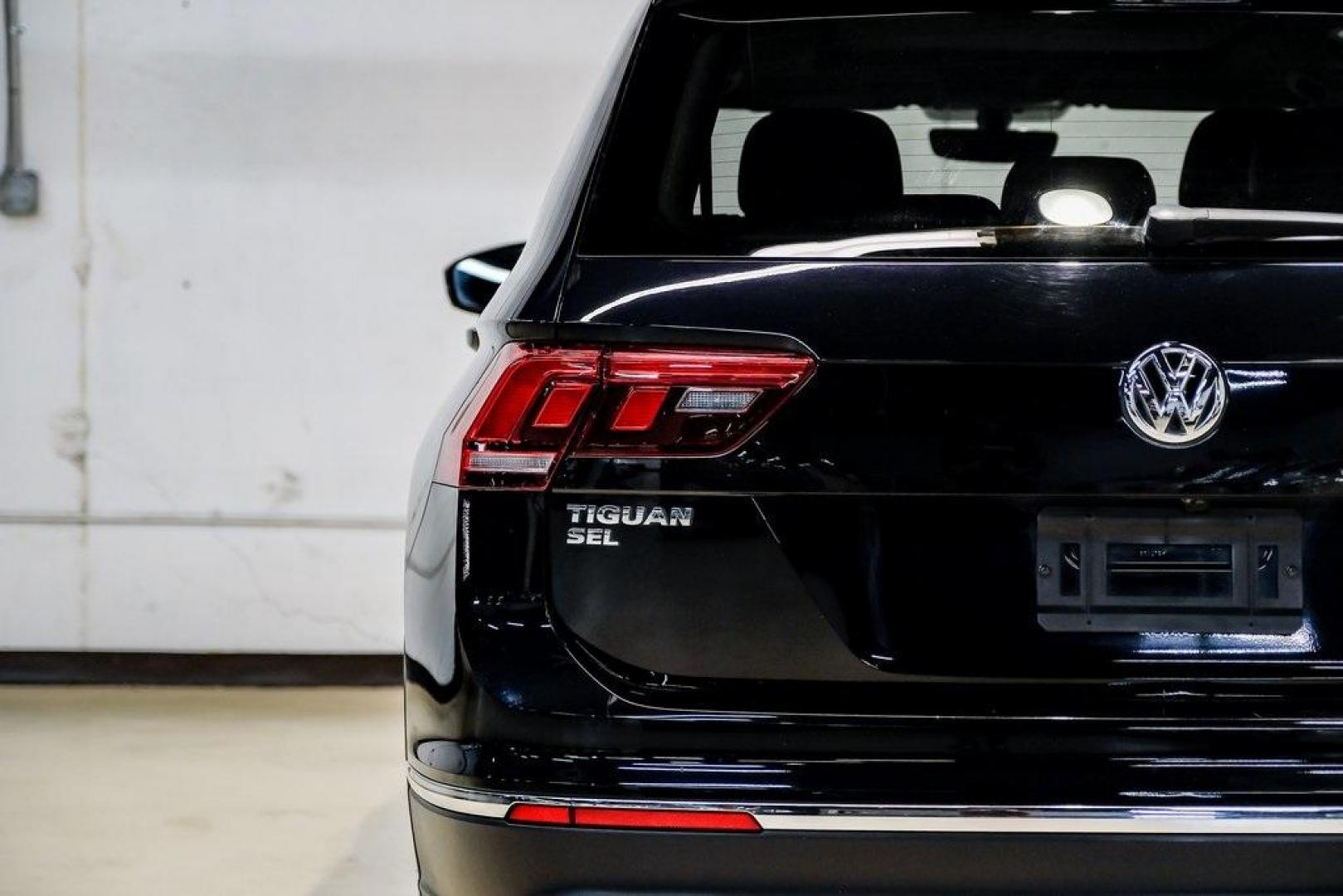 2019 Deep Black /Golden Oak and Black Volkswagen Tiguan 2.0T SEL (3VV3B7AX4KM) with an 2.0L TSI DOHC engine, Automatic transmission, located at 15300 Midway Rd., Addison, TX, 75001, (972) 702-0011, 32.958321, -96.838074 - Photo#58