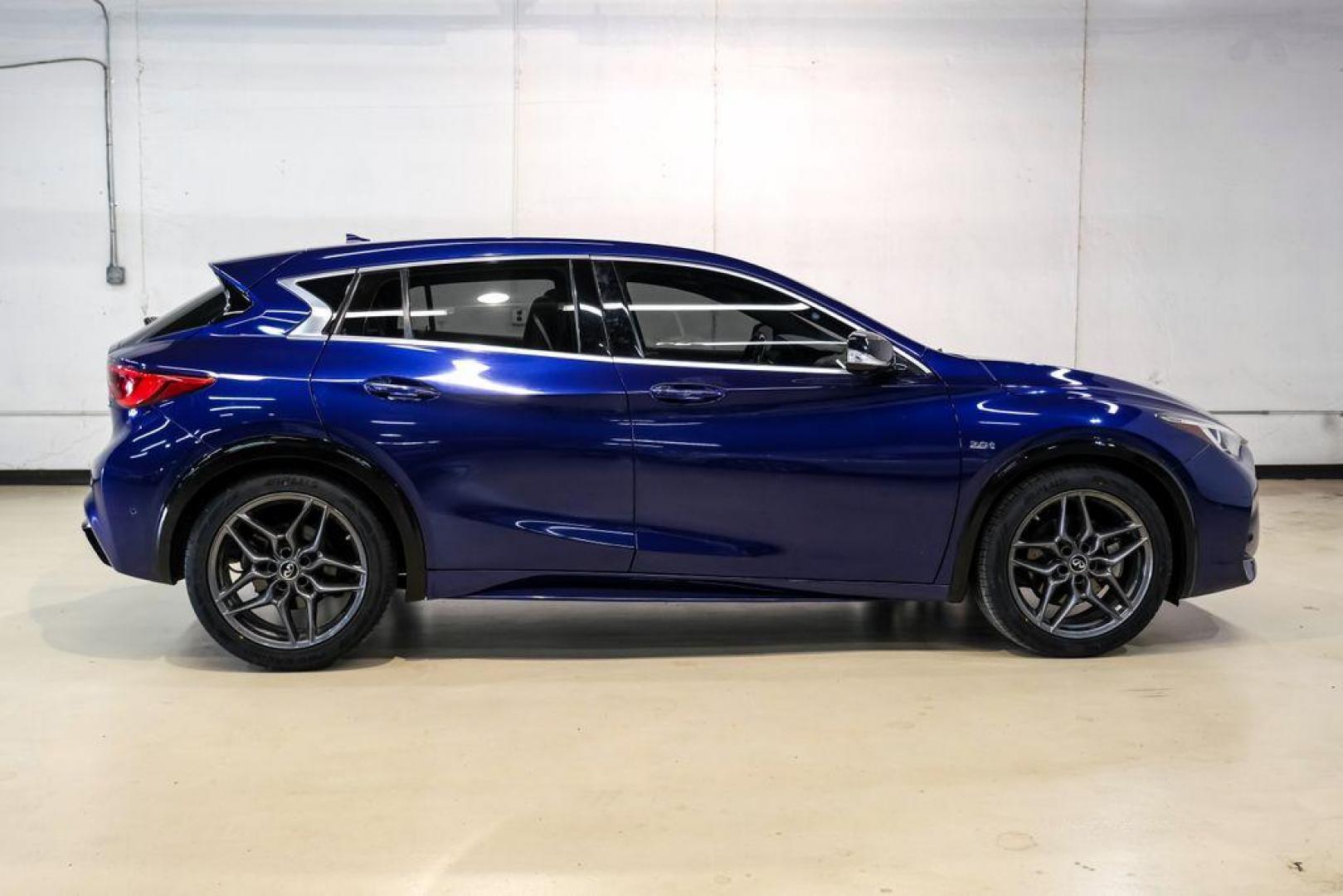 2019 Ink Blue /Graphite INFINITI QX30 Sport (SJKCH5CP8KA) with an 2.0L I4 DOHC Turbocharged engine, Automatic transmission, located at 15300 Midway Rd., Addison, TX, 75001, (972) 702-0011, 32.958321, -96.838074 - 2019 INFINITI QX30 Sport<br><br>Now Available at Midway Auto Group, Addison, Texas<br><br>Aggressive, athletic, and premium the 2019 INFINITI QX30 Sport stands out with its lower stance, sport-tuned suspension, upgraded interior, and bold styling enhancements. As the performance-oriented model in th - Photo#7