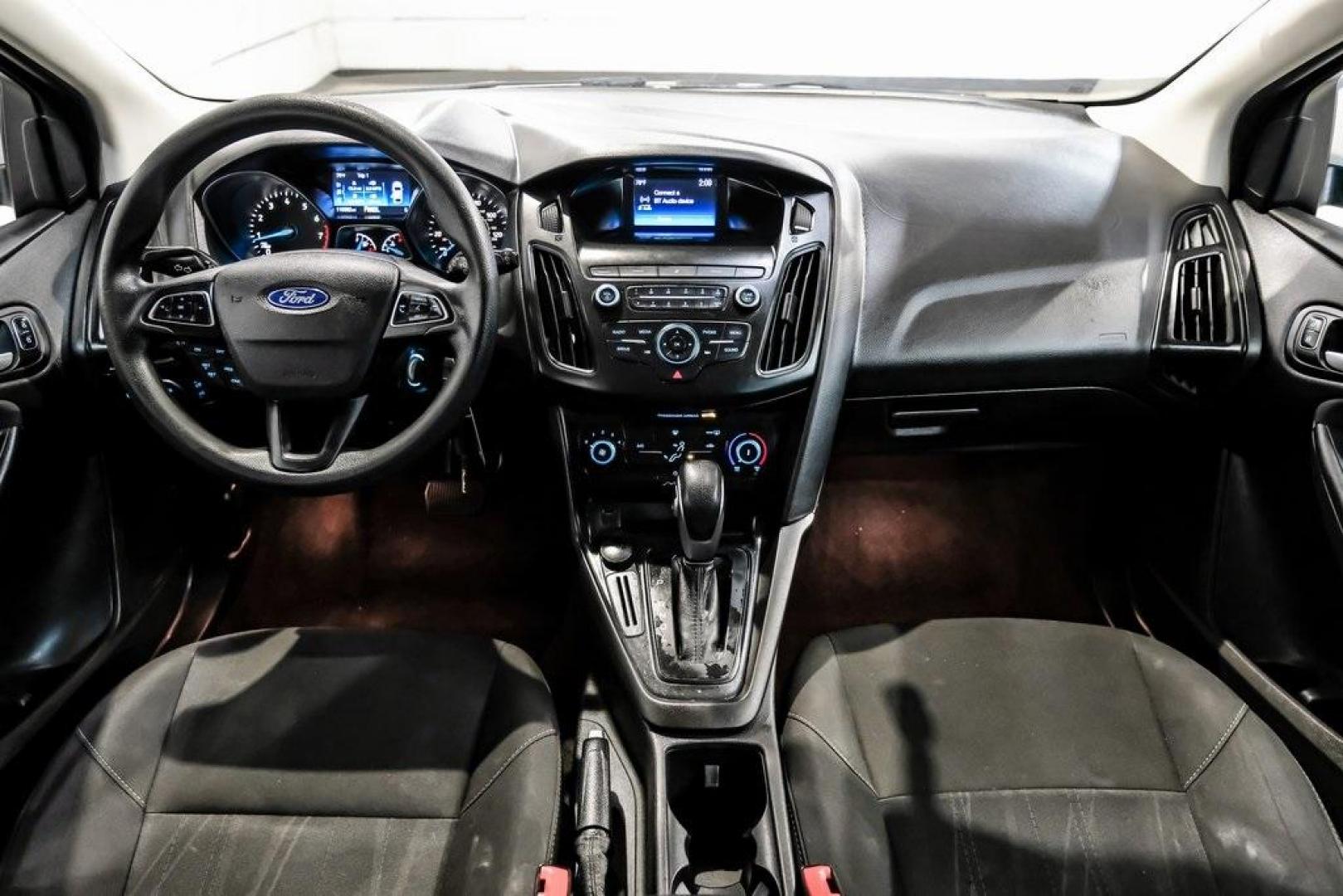 2018 Oxford White /Black Ford Focus SE (1FADP3K23JL) with an 2.0L I4 DGI Ti-VCT engine, Automatic transmission, located at 15300 Midway Rd., Addison, TX, 75001, (972) 702-0011, 32.958321, -96.838074 - Photo#2