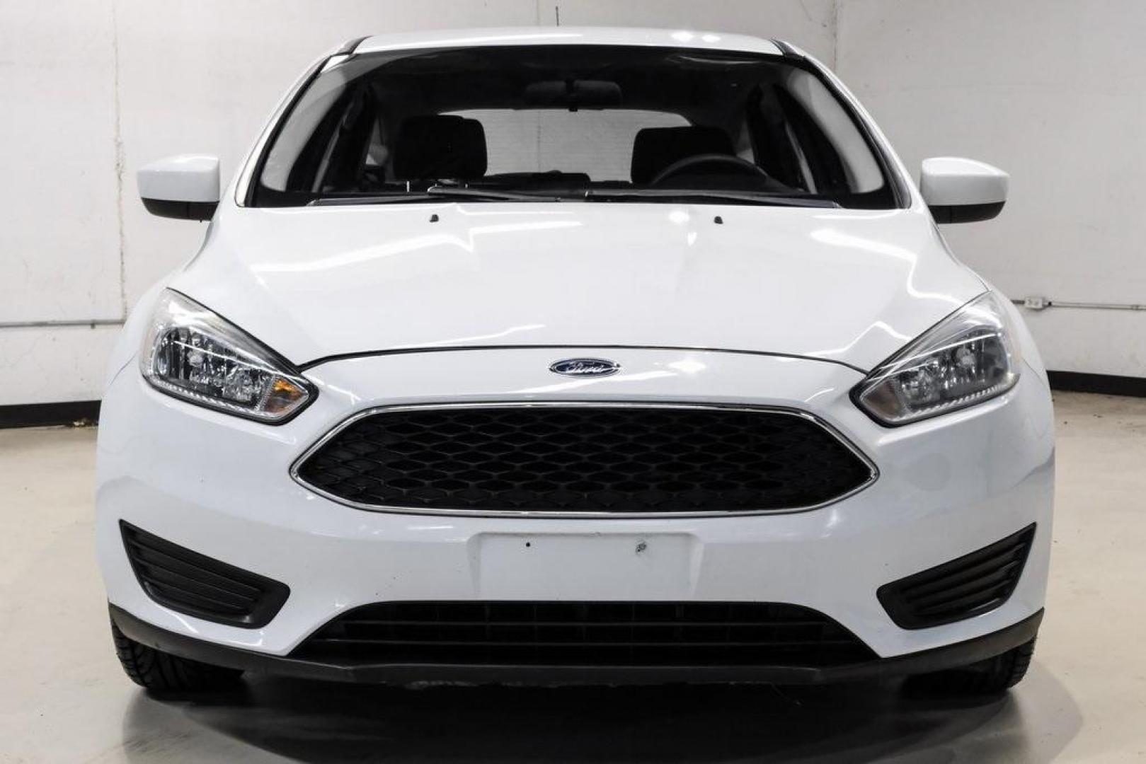 2018 Oxford White /Black Ford Focus SE (1FADP3K23JL) with an 2.0L I4 DGI Ti-VCT engine, Automatic transmission, located at 15300 Midway Rd., Addison, TX, 75001, (972) 702-0011, 32.958321, -96.838074 - Photo#3