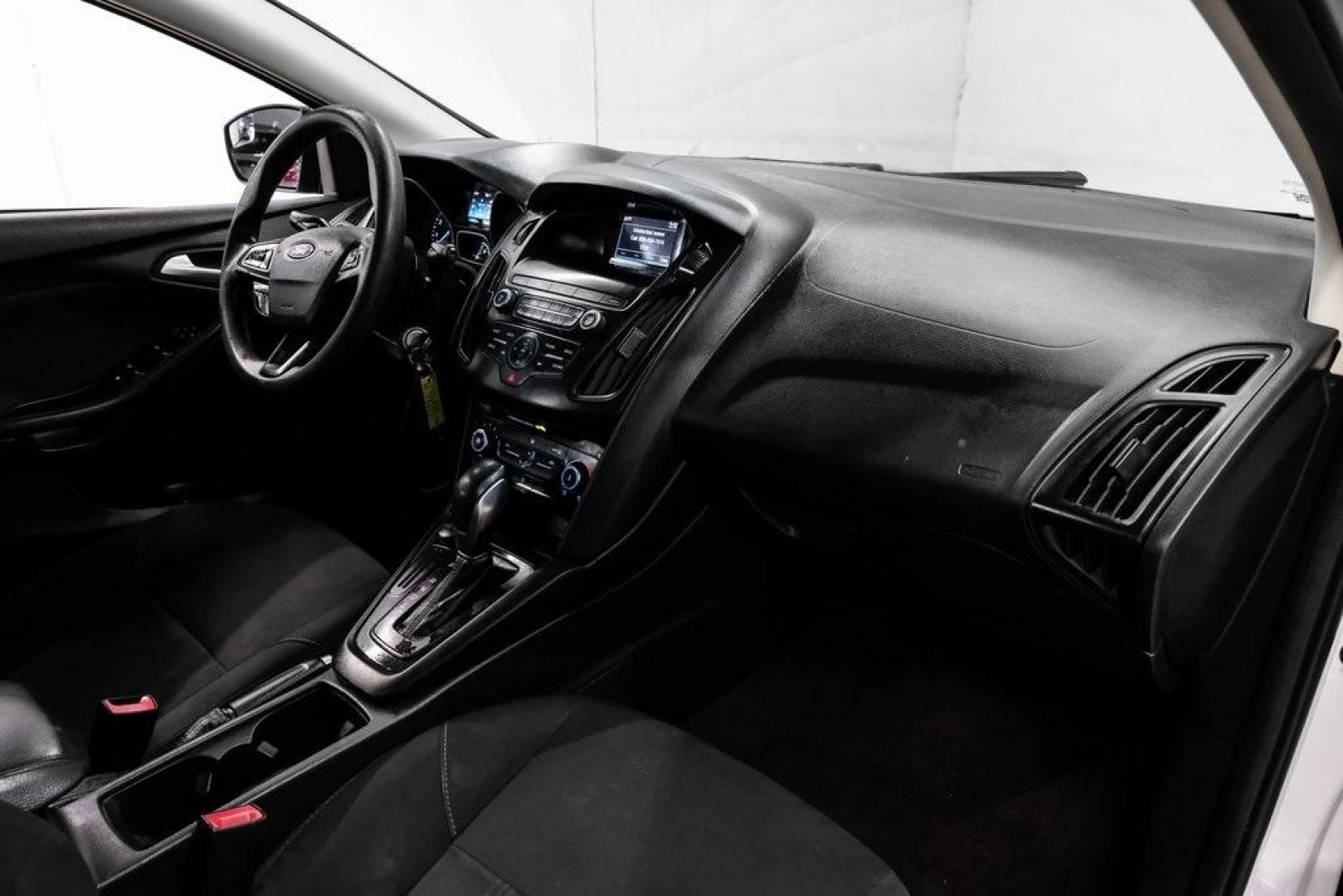 2018 Oxford White /Black Ford Focus SE (1FADP3K23JL) with an 2.0L I4 DGI Ti-VCT engine, Automatic transmission, located at 15300 Midway Rd., Addison, TX, 75001, (972) 702-0011, 32.958321, -96.838074 - Photo#12