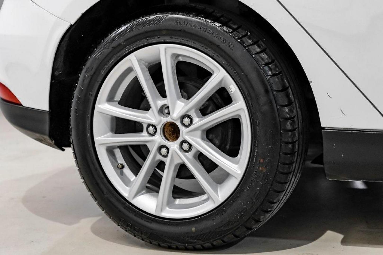 2018 Oxford White /Black Ford Focus SE (1FADP3K23JL) with an 2.0L I4 DGI Ti-VCT engine, Automatic transmission, located at 15300 Midway Rd., Addison, TX, 75001, (972) 702-0011, 32.958321, -96.838074 - Photo#43