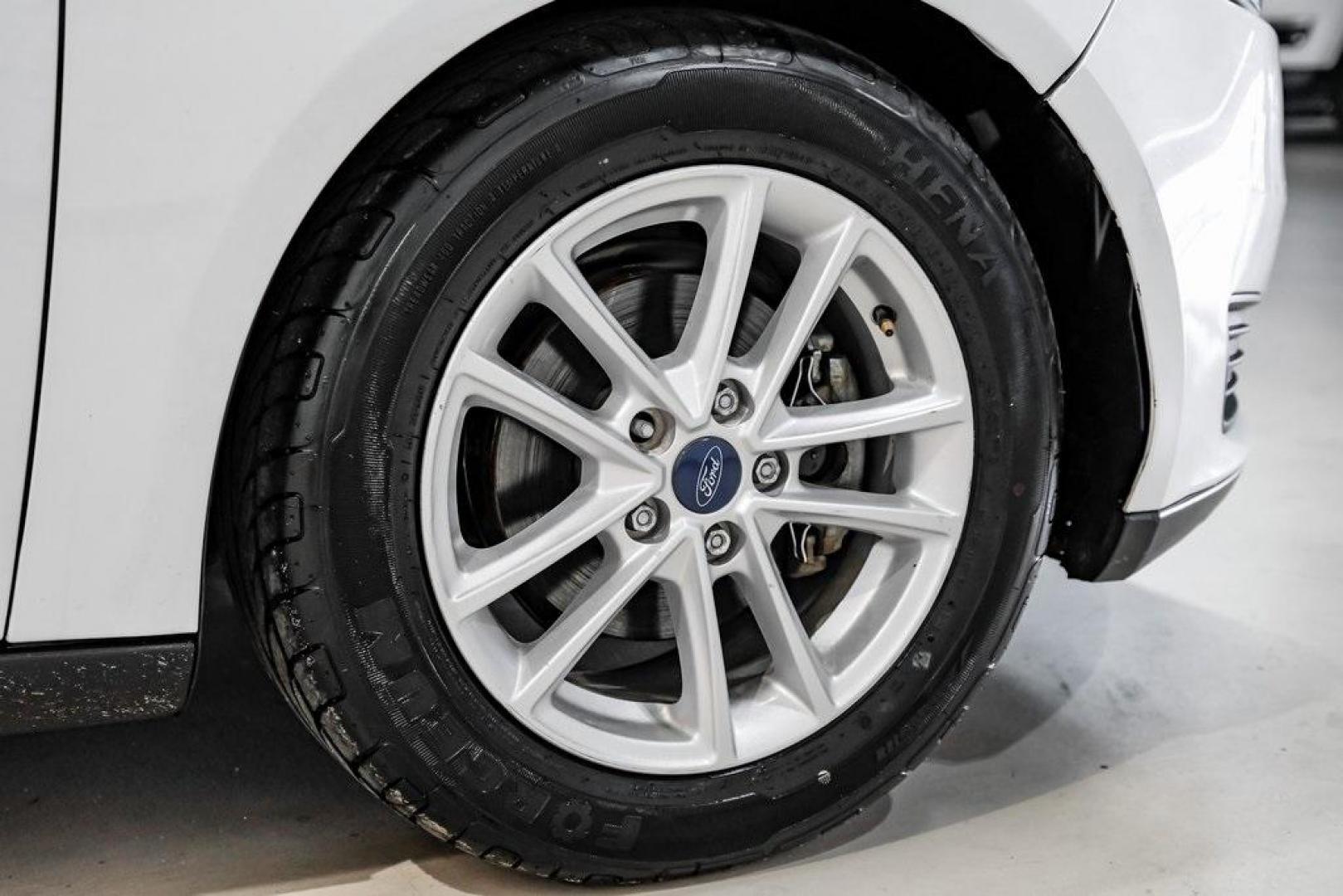 2018 Oxford White /Black Ford Focus SE (1FADP3K23JL) with an 2.0L I4 DGI Ti-VCT engine, Automatic transmission, located at 15300 Midway Rd., Addison, TX, 75001, (972) 702-0011, 32.958321, -96.838074 - Photo#44