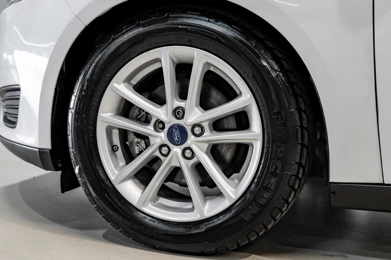 2018 Oxford White /Black Ford Focus SE (1FADP3K23JL) with an 2.0L I4 DGI Ti-VCT engine, Automatic transmission, located at 15300 Midway Rd., Addison, TX, 75001, (972) 702-0011, 32.958321, -96.838074 - Photo#45