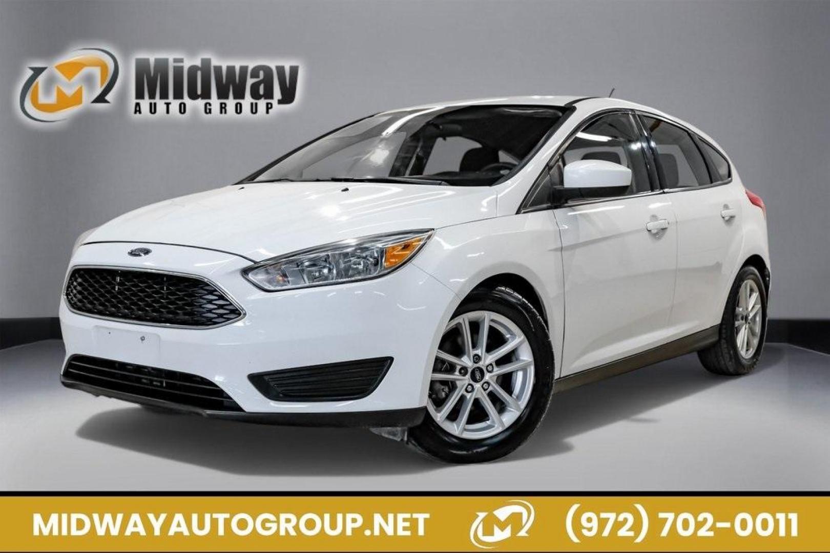 2018 Oxford White /Black Ford Focus SE (1FADP3K23JL) with an 2.0L I4 DGI Ti-VCT engine, Automatic transmission, located at 15300 Midway Rd., Addison, TX, 75001, (972) 702-0011, 32.958321, -96.838074 - 2018 Ford Focus SE<br><br>Now Available at Midway Auto Group, Addison, Texas<br><br>Efficient, comfortable, and great for everyday driving the 2018 Ford Focus SE delivers excellent fuel economy, modern technology, and a smooth, enjoyable ride. Whether you're commuting across DFW, shopping for a firs - Photo#0