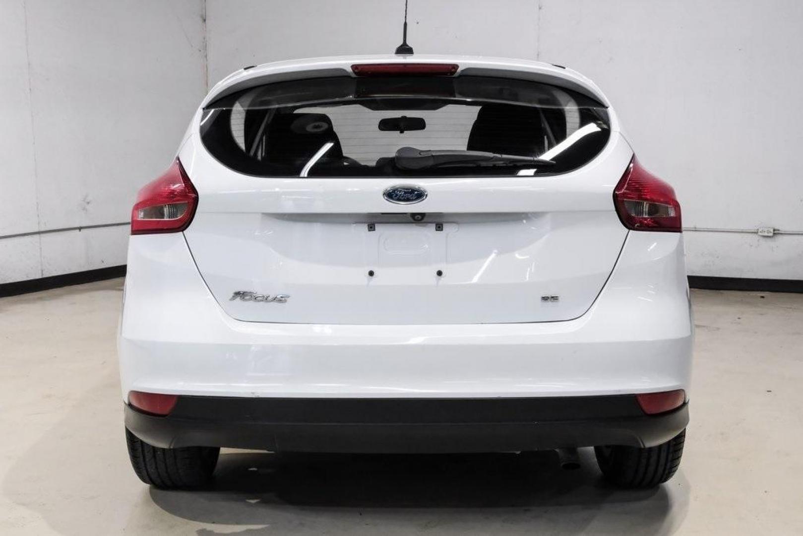 2018 Oxford White /Black Ford Focus SE (1FADP3K23JL) with an 2.0L I4 DGI Ti-VCT engine, Automatic transmission, located at 15300 Midway Rd., Addison, TX, 75001, (972) 702-0011, 32.958321, -96.838074 - 2018 Ford Focus SE<br><br>Now Available at Midway Auto Group, Addison, Texas<br><br>Efficient, comfortable, and great for everyday driving the 2018 Ford Focus SE delivers excellent fuel economy, modern technology, and a smooth, enjoyable ride. Whether you're commuting across DFW, shopping for a firs - Photo#7