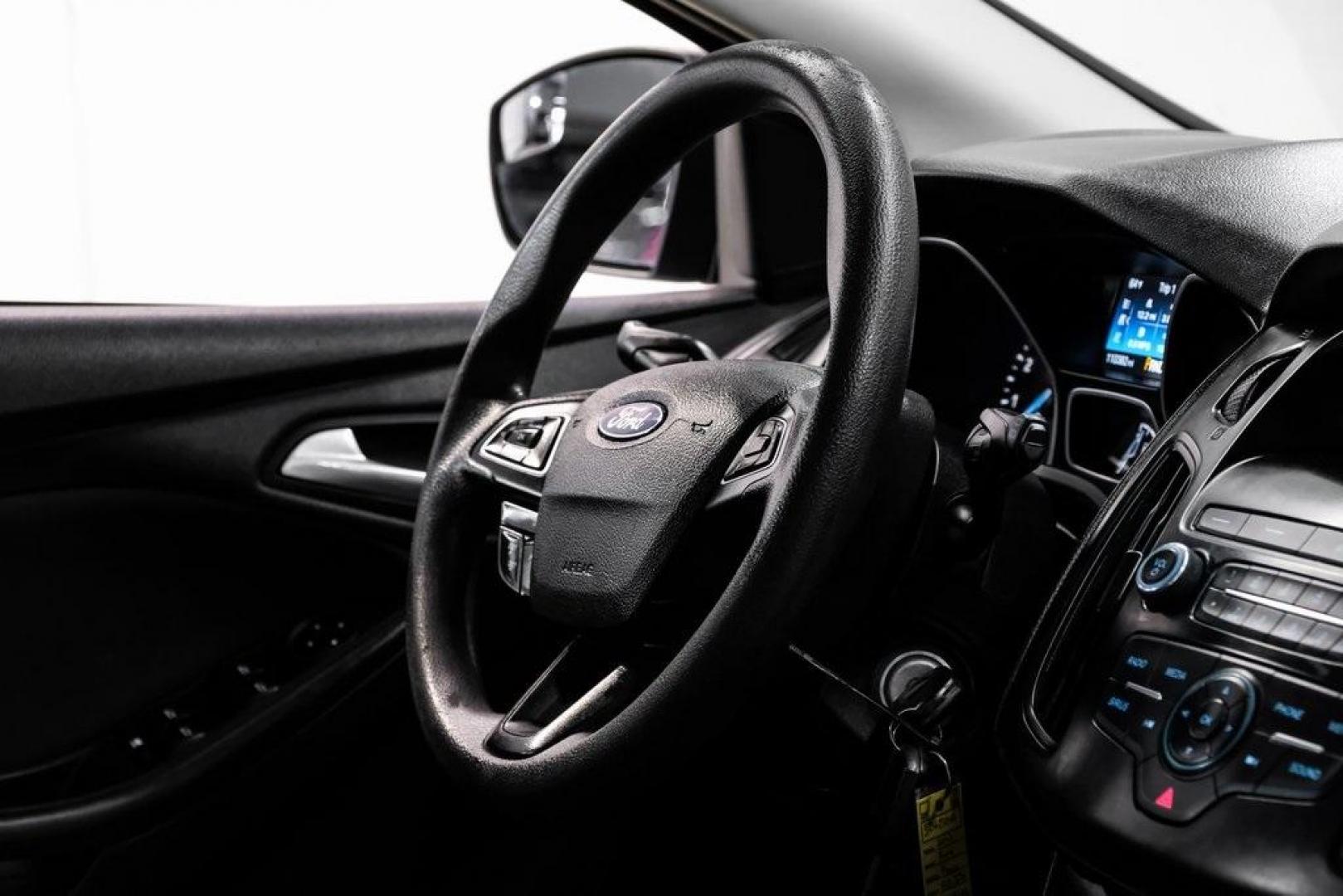 2018 Oxford White /Black Ford Focus SE (1FADP3K23JL) with an 2.0L I4 DGI Ti-VCT engine, Automatic transmission, located at 15300 Midway Rd., Addison, TX, 75001, (972) 702-0011, 32.958321, -96.838074 - 2018 Ford Focus SE<br><br>Now Available at Midway Auto Group, Addison, Texas<br><br>Efficient, comfortable, and great for everyday driving the 2018 Ford Focus SE delivers excellent fuel economy, modern technology, and a smooth, enjoyable ride. Whether you're commuting across DFW, shopping for a firs - Photo#13