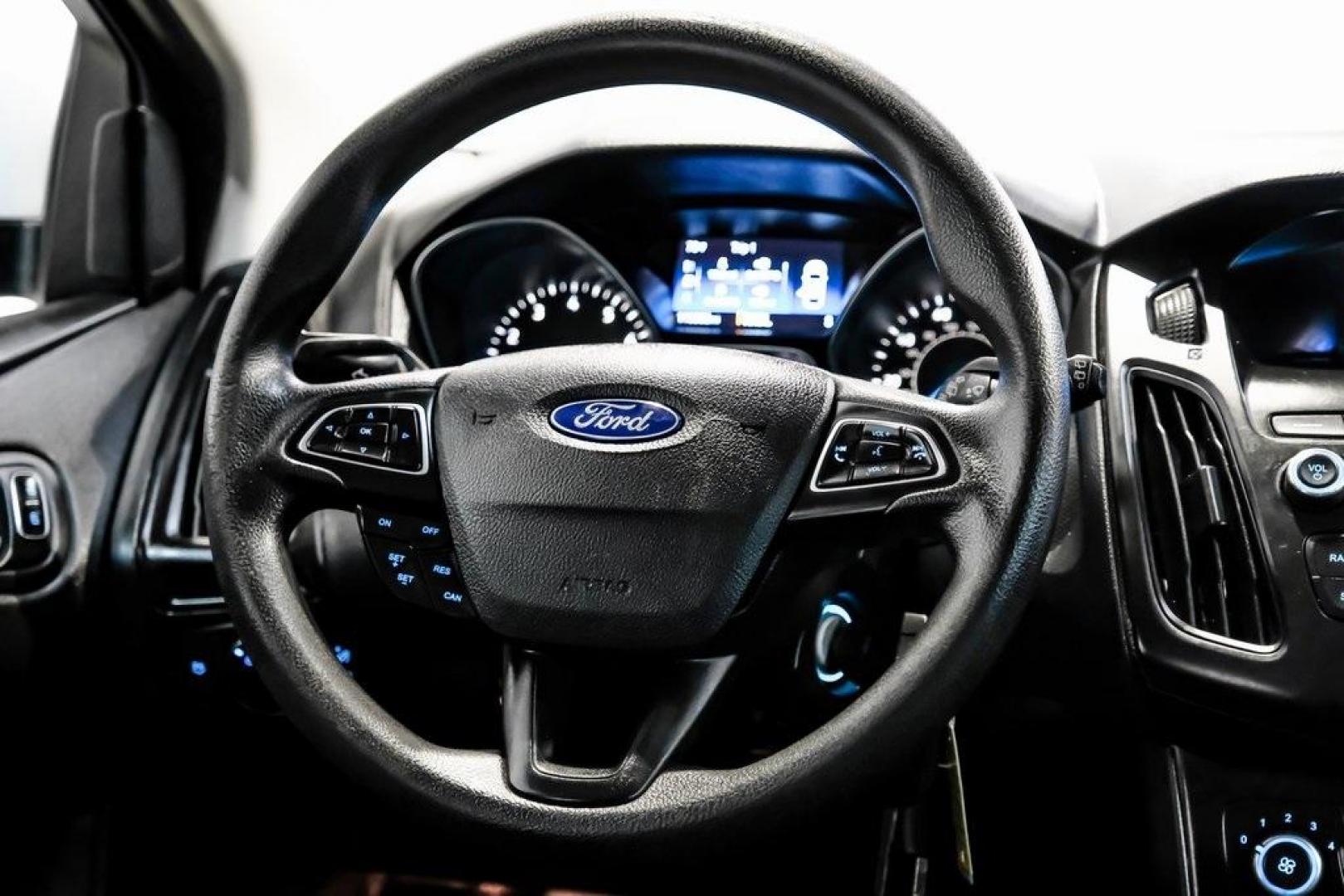 2018 Oxford White /Black Ford Focus SE (1FADP3K23JL) with an 2.0L I4 DGI Ti-VCT engine, Automatic transmission, located at 15300 Midway Rd., Addison, TX, 75001, (972) 702-0011, 32.958321, -96.838074 - 2018 Ford Focus SE<br><br>Now Available at Midway Auto Group, Addison, Texas<br><br>Efficient, comfortable, and great for everyday driving the 2018 Ford Focus SE delivers excellent fuel economy, modern technology, and a smooth, enjoyable ride. Whether you're commuting across DFW, shopping for a firs - Photo#15