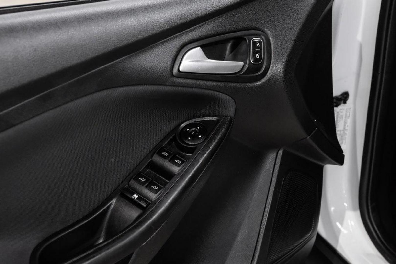 2018 Oxford White /Black Ford Focus SE (1FADP3K23JL) with an 2.0L I4 DGI Ti-VCT engine, Automatic transmission, located at 15300 Midway Rd., Addison, TX, 75001, (972) 702-0011, 32.958321, -96.838074 - 2018 Ford Focus SE<br><br>Now Available at Midway Auto Group, Addison, Texas<br><br>Efficient, comfortable, and great for everyday driving the 2018 Ford Focus SE delivers excellent fuel economy, modern technology, and a smooth, enjoyable ride. Whether you're commuting across DFW, shopping for a firs - Photo#35