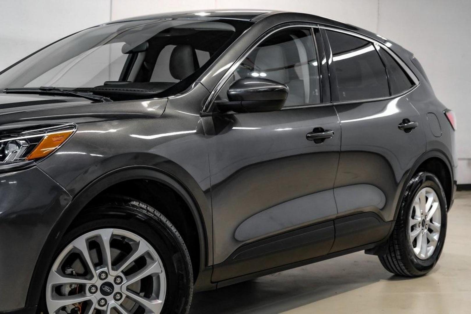 2020 Magnetic /Sandstone Ford Escape SE (1FMCU0G6XLU) with an 1.5L EcoBoost engine, Automatic transmission, located at 15300 Midway Rd., Addison, TX, 75001, (972) 702-0011, 32.958321, -96.838074 - Photo#5