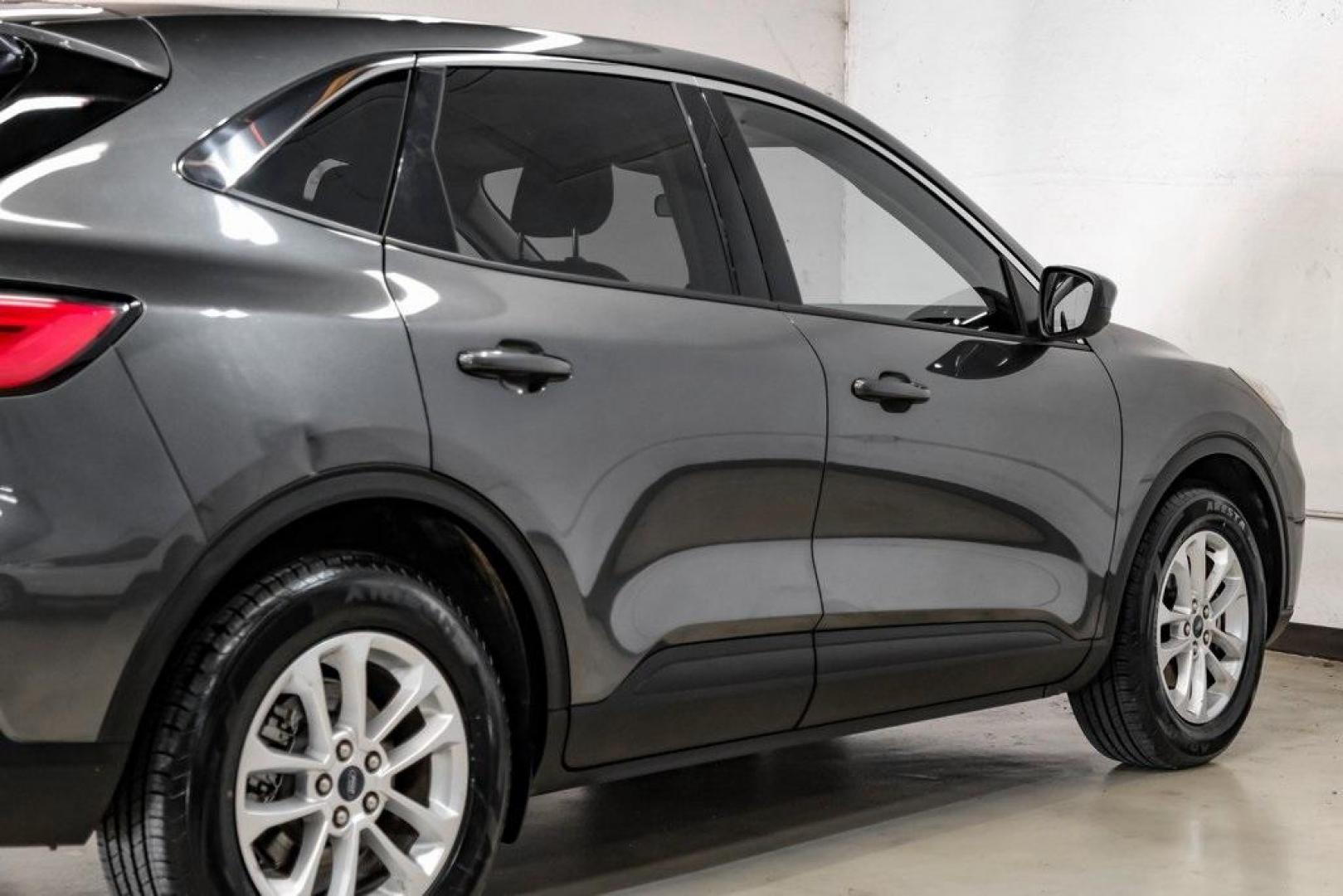 2020 Magnetic /Sandstone Ford Escape SE (1FMCU0G6XLU) with an 1.5L EcoBoost engine, Automatic transmission, located at 15300 Midway Rd., Addison, TX, 75001, (972) 702-0011, 32.958321, -96.838074 - Photo#13