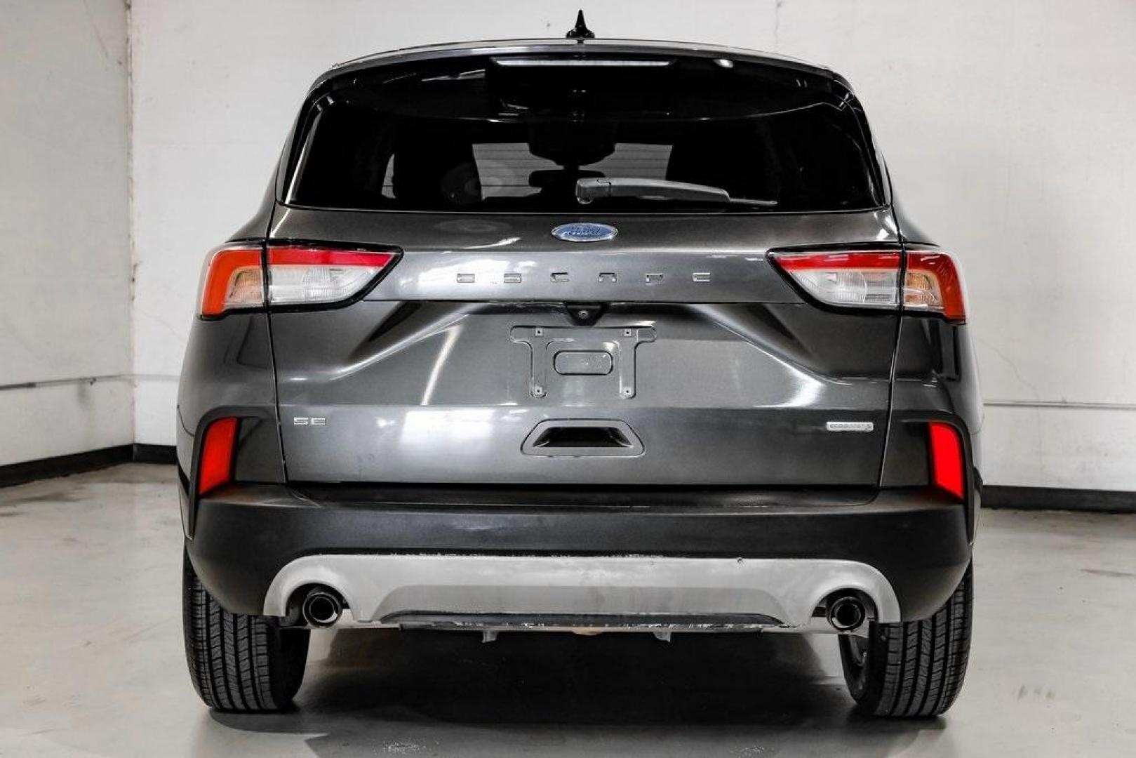 2020 Magnetic /Sandstone Ford Escape SE (1FMCU0G6XLU) with an 1.5L EcoBoost engine, Automatic transmission, located at 15300 Midway Rd., Addison, TX, 75001, (972) 702-0011, 32.958321, -96.838074 - Photo#14