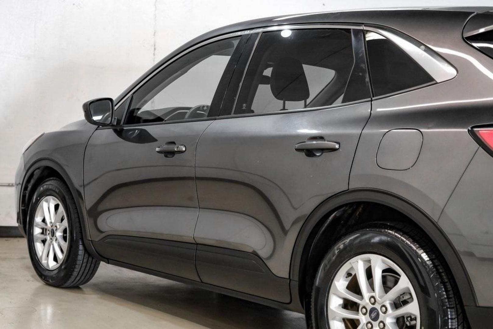 2020 Magnetic /Sandstone Ford Escape SE (1FMCU0G6XLU) with an 1.5L EcoBoost engine, Automatic transmission, located at 15300 Midway Rd., Addison, TX, 75001, (972) 702-0011, 32.958321, -96.838074 - Photo#16