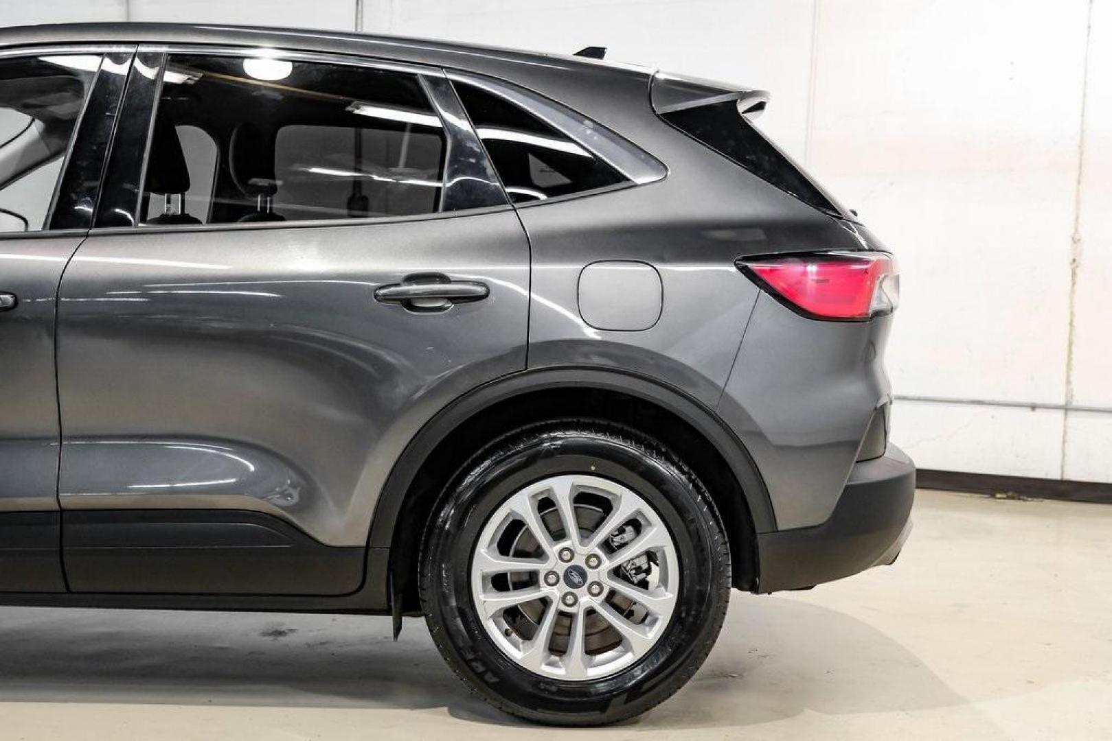 2020 Magnetic /Sandstone Ford Escape SE (1FMCU0G6XLU) with an 1.5L EcoBoost engine, Automatic transmission, located at 15300 Midway Rd., Addison, TX, 75001, (972) 702-0011, 32.958321, -96.838074 - Photo#19