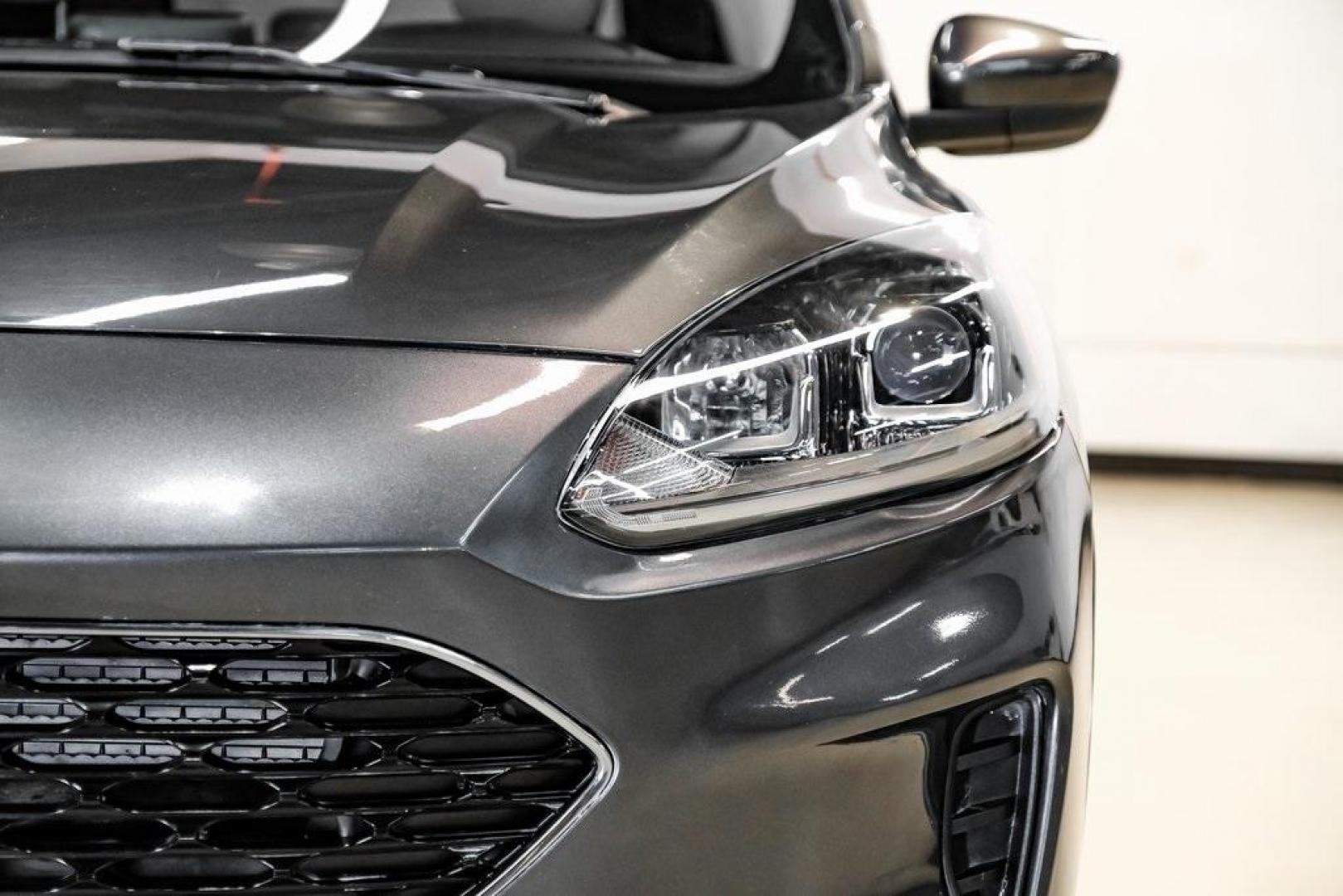 2020 Magnetic /Sandstone Ford Escape SE (1FMCU0G6XLU) with an 1.5L EcoBoost engine, Automatic transmission, located at 15300 Midway Rd., Addison, TX, 75001, (972) 702-0011, 32.958321, -96.838074 - Photo#54