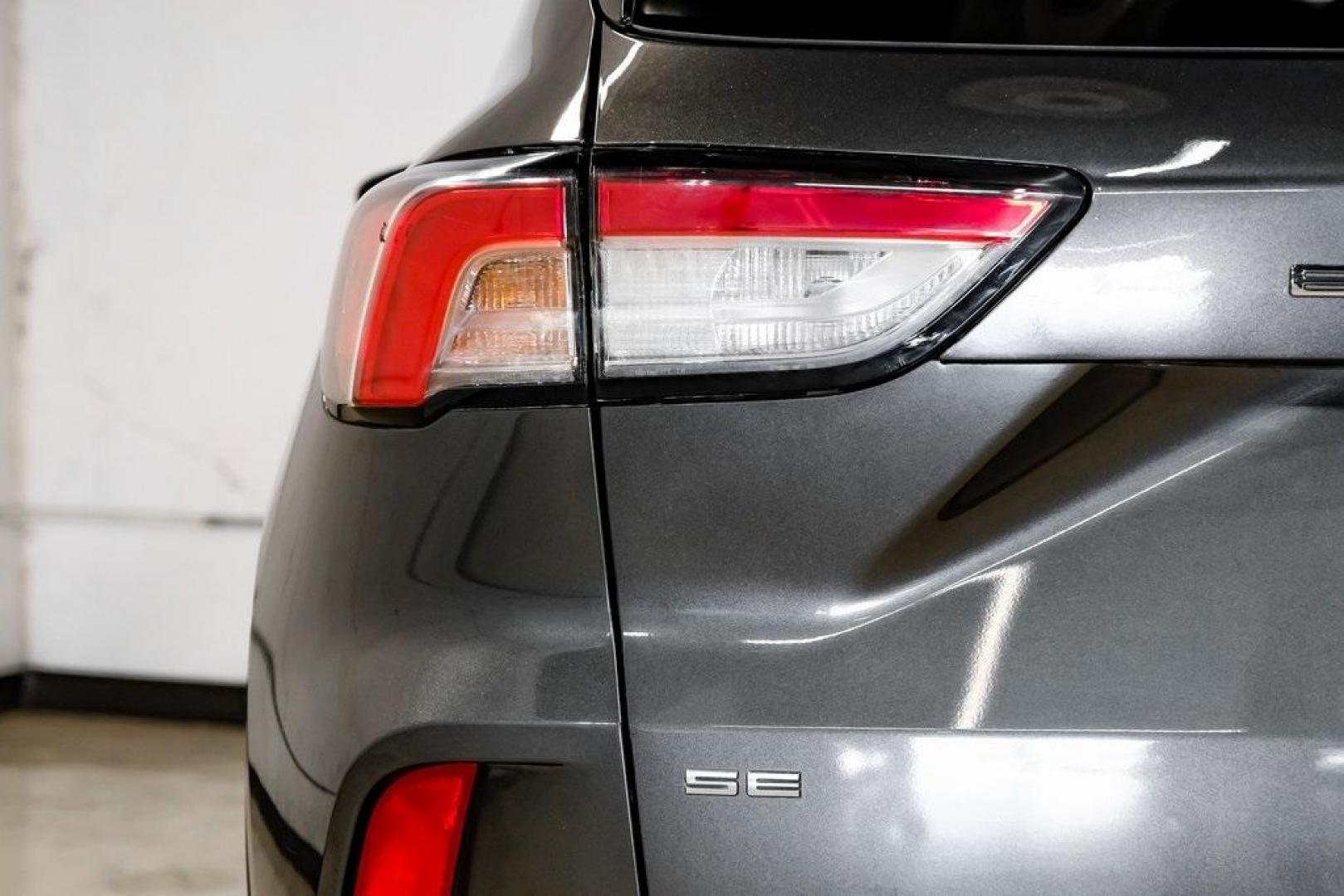 2020 Magnetic /Sandstone Ford Escape SE (1FMCU0G6XLU) with an 1.5L EcoBoost engine, Automatic transmission, located at 15300 Midway Rd., Addison, TX, 75001, (972) 702-0011, 32.958321, -96.838074 - Photo#55