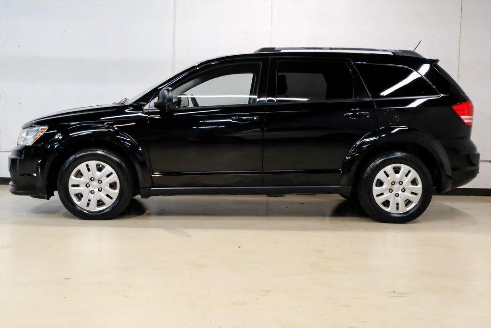 2017 Pitch Black Clearcoat /Black Dodge Journey SE (3C4PDCAB3HT) with an 2.4L I4 DOHC 16V Dual VVT engine, Automatic transmission, located at 15300 Midway Rd., Addison, TX, 75001, (972) 702-0011, 32.958321, -96.838074 - 2017 Dodge Journey SE<br><br>Now Available at Midway Auto Group, Addison, Texas<br><br>Practical, versatile, and budget-friendly, the 2017 Dodge Journey SE is a midsize SUV that delivers space, comfort, and value. With flexible seating, strong reliability, and a smooth driving feel, the Journey SE i - Photo#12