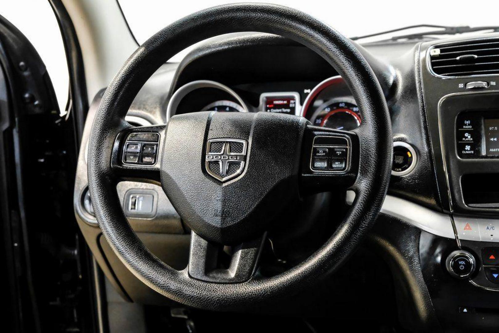 2017 Pitch Black Clearcoat /Black Dodge Journey SE (3C4PDCAB3HT) with an 2.4L I4 DOHC 16V Dual VVT engine, Automatic transmission, located at 15300 Midway Rd., Addison, TX, 75001, (972) 702-0011, 32.958321, -96.838074 - 2017 Dodge Journey SE<br><br>Now Available at Midway Auto Group, Addison, Texas<br><br>Practical, versatile, and budget-friendly, the 2017 Dodge Journey SE is a midsize SUV that delivers space, comfort, and value. With flexible seating, strong reliability, and a smooth driving feel, the Journey SE i - Photo#19