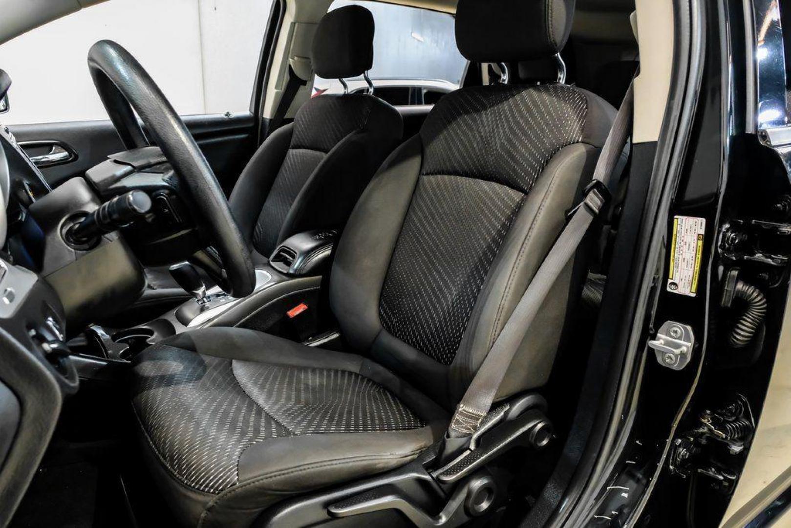 2017 Pitch Black Clearcoat /Black Dodge Journey SE (3C4PDCAB3HT) with an 2.4L I4 DOHC 16V Dual VVT engine, Automatic transmission, located at 15300 Midway Rd., Addison, TX, 75001, (972) 702-0011, 32.958321, -96.838074 - 2017 Dodge Journey SE<br><br>Now Available at Midway Auto Group, Addison, Texas<br><br>Practical, versatile, and budget-friendly, the 2017 Dodge Journey SE is a midsize SUV that delivers space, comfort, and value. With flexible seating, strong reliability, and a smooth driving feel, the Journey SE i - Photo#31