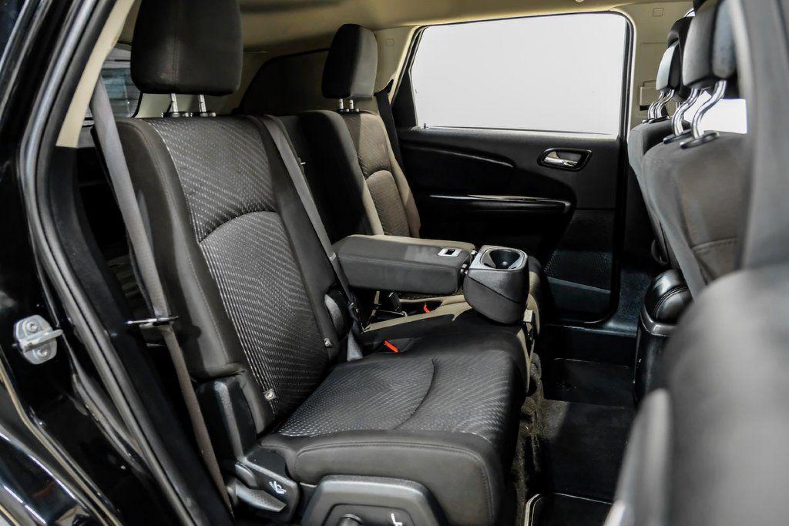 2017 Pitch Black Clearcoat /Black Dodge Journey SE (3C4PDCAB3HT) with an 2.4L I4 DOHC 16V Dual VVT engine, Automatic transmission, located at 15300 Midway Rd., Addison, TX, 75001, (972) 702-0011, 32.958321, -96.838074 - 2017 Dodge Journey SE<br><br>Now Available at Midway Auto Group, Addison, Texas<br><br>Practical, versatile, and budget-friendly, the 2017 Dodge Journey SE is a midsize SUV that delivers space, comfort, and value. With flexible seating, strong reliability, and a smooth driving feel, the Journey SE i - Photo#34