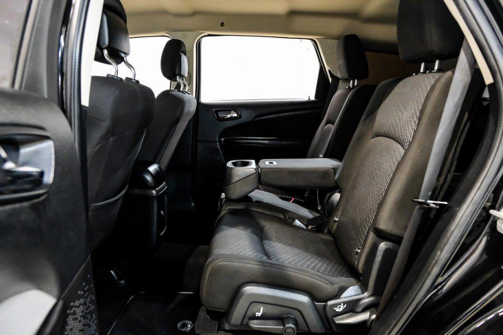 2017 Pitch Black Clearcoat /Black Dodge Journey SE (3C4PDCAB3HT) with an 2.4L I4 DOHC 16V Dual VVT engine, Automatic transmission, located at 15300 Midway Rd., Addison, TX, 75001, (972) 702-0011, 32.958321, -96.838074 - 2017 Dodge Journey SE<br><br>Now Available at Midway Auto Group, Addison, Texas<br><br>Practical, versatile, and budget-friendly, the 2017 Dodge Journey SE is a midsize SUV that delivers space, comfort, and value. With flexible seating, strong reliability, and a smooth driving feel, the Journey SE i - Photo#38