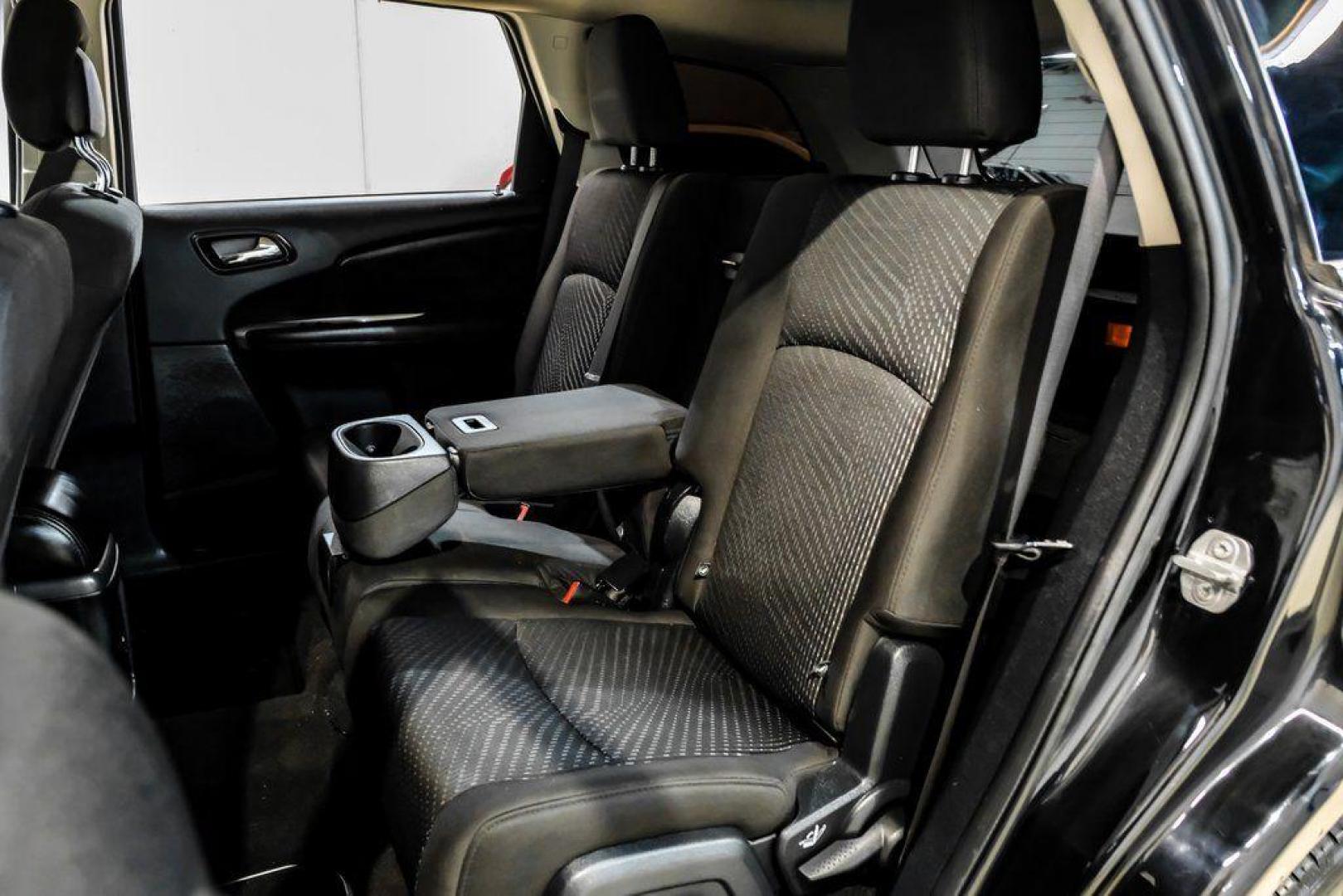 2017 Pitch Black Clearcoat /Black Dodge Journey SE (3C4PDCAB3HT) with an 2.4L I4 DOHC 16V Dual VVT engine, Automatic transmission, located at 15300 Midway Rd., Addison, TX, 75001, (972) 702-0011, 32.958321, -96.838074 - 2017 Dodge Journey SE<br><br>Now Available at Midway Auto Group, Addison, Texas<br><br>Practical, versatile, and budget-friendly, the 2017 Dodge Journey SE is a midsize SUV that delivers space, comfort, and value. With flexible seating, strong reliability, and a smooth driving feel, the Journey SE i - Photo#39