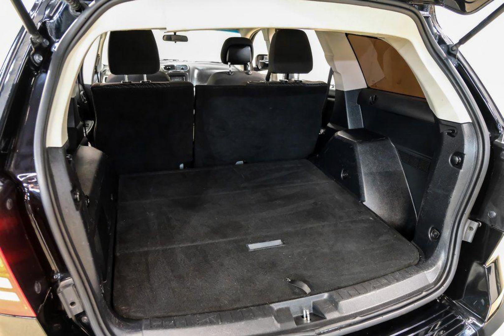 2017 Pitch Black Clearcoat /Black Dodge Journey SE (3C4PDCAB3HT) with an 2.4L I4 DOHC 16V Dual VVT engine, Automatic transmission, located at 15300 Midway Rd., Addison, TX, 75001, (972) 702-0011, 32.958321, -96.838074 - 2017 Dodge Journey SE<br><br>Now Available at Midway Auto Group, Addison, Texas<br><br>Practical, versatile, and budget-friendly, the 2017 Dodge Journey SE is a midsize SUV that delivers space, comfort, and value. With flexible seating, strong reliability, and a smooth driving feel, the Journey SE i - Photo#50