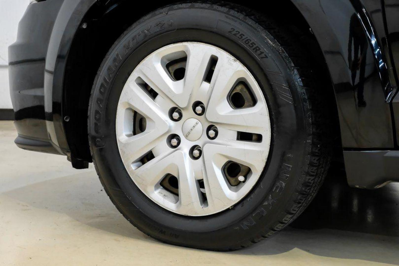 2017 Pitch Black Clearcoat /Black Dodge Journey SE (3C4PDCAB3HT) with an 2.4L I4 DOHC 16V Dual VVT engine, Automatic transmission, located at 15300 Midway Rd., Addison, TX, 75001, (972) 702-0011, 32.958321, -96.838074 - 2017 Dodge Journey SE<br><br>Now Available at Midway Auto Group, Addison, Texas<br><br>Practical, versatile, and budget-friendly, the 2017 Dodge Journey SE is a midsize SUV that delivers space, comfort, and value. With flexible seating, strong reliability, and a smooth driving feel, the Journey SE i - Photo#53