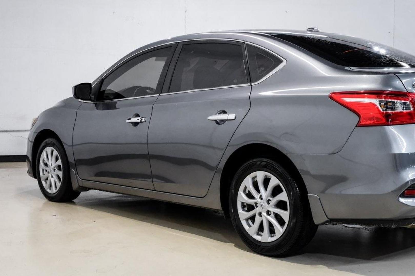 2019 Gun Metallic /Charcoal Nissan Sentra SV (3N1AB7AP4KL) with an 1.8L 4-Cylinder DOHC 16V engine, CVT transmission, located at 15300 Midway Rd., Addison, TX, 75001, (972) 702-0011, 32.958321, -96.838074 - 2019 Nissan Sentra SV<br><br>Now Available at Midway Auto Group, Addison, Texas<br><br>Comfortable, efficient, and packed with the 2019 Nissan Sentra SV is a step up from the base model, offering upgraded technology, refined interior features, and excellent fuel economy. With its spacious cabin and - Photo#16