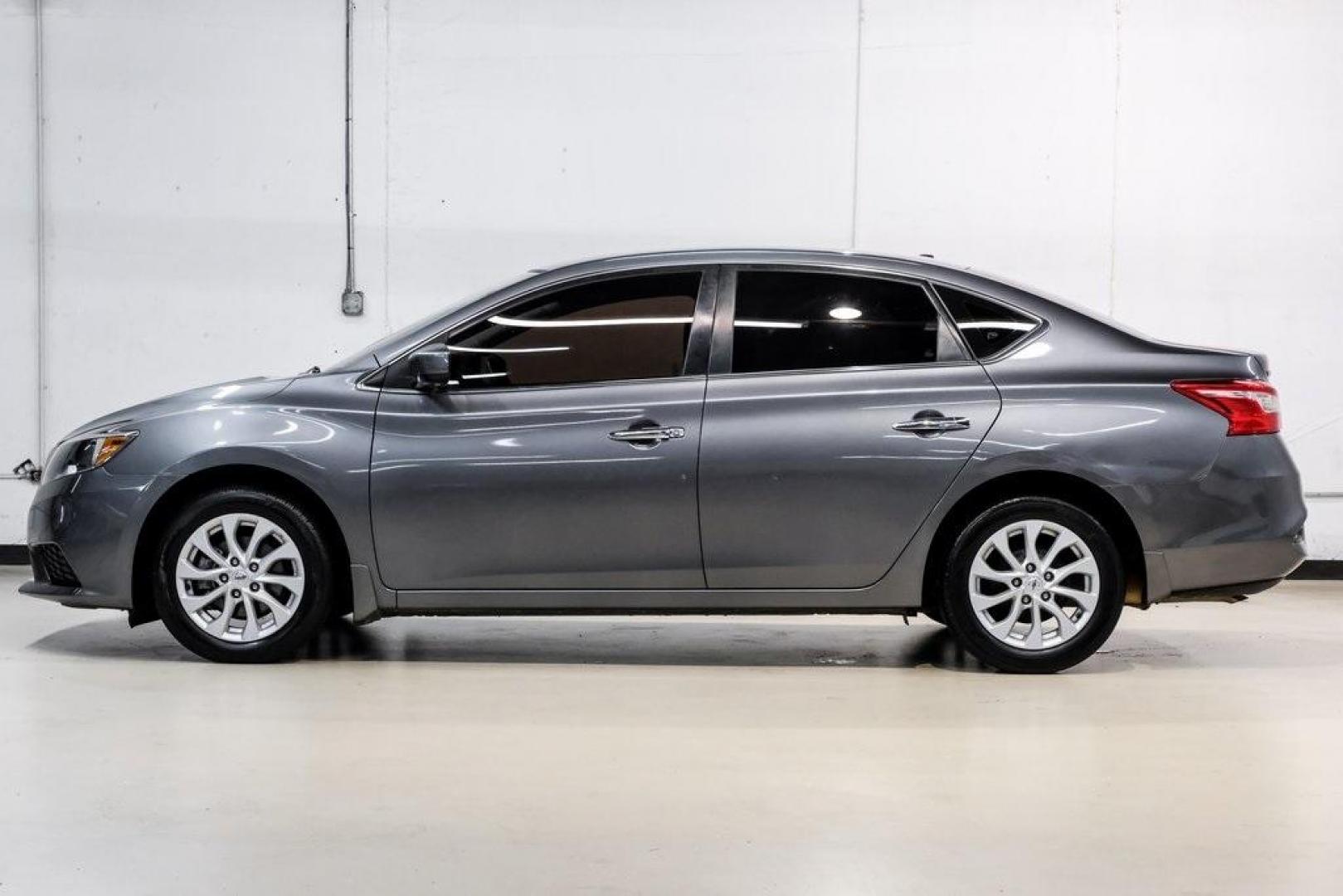 2019 Gun Metallic /Charcoal Nissan Sentra SV (3N1AB7AP4KL) with an 1.8L 4-Cylinder DOHC 16V engine, CVT transmission, located at 15300 Midway Rd., Addison, TX, 75001, (972) 702-0011, 32.958321, -96.838074 - 2019 Nissan Sentra SV<br><br>Now Available at Midway Auto Group, Addison, Texas<br><br>Comfortable, efficient, and packed with the 2019 Nissan Sentra SV is a step up from the base model, offering upgraded technology, refined interior features, and excellent fuel economy. With its spacious cabin and - Photo#18