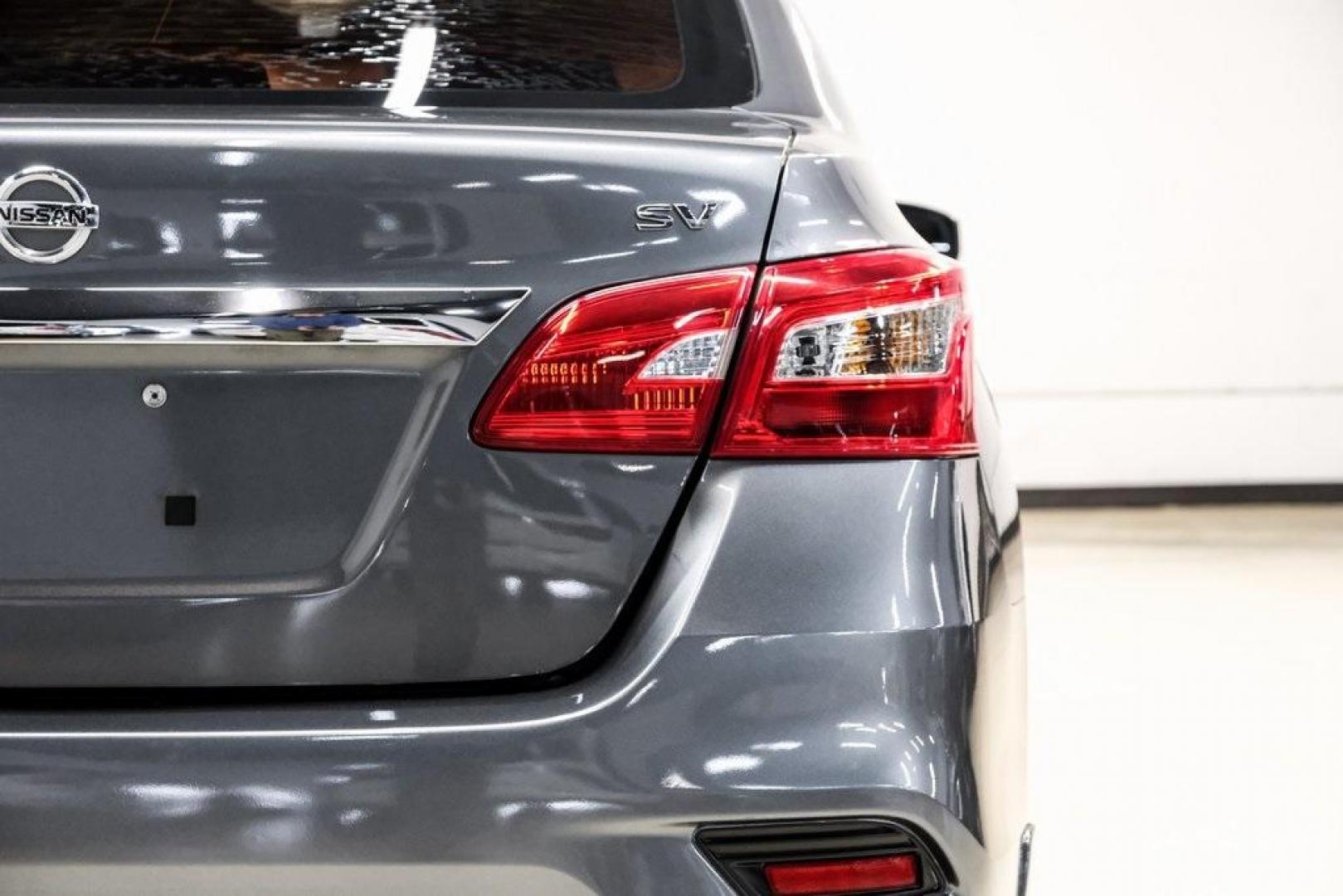 2019 Gun Metallic /Charcoal Nissan Sentra SV (3N1AB7AP4KL) with an 1.8L 4-Cylinder DOHC 16V engine, CVT transmission, located at 15300 Midway Rd., Addison, TX, 75001, (972) 702-0011, 32.958321, -96.838074 - 2019 Nissan Sentra SV<br><br>Now Available at Midway Auto Group, Addison, Texas<br><br>Comfortable, efficient, and packed with the 2019 Nissan Sentra SV is a step up from the base model, offering upgraded technology, refined interior features, and excellent fuel economy. With its spacious cabin and - Photo#56