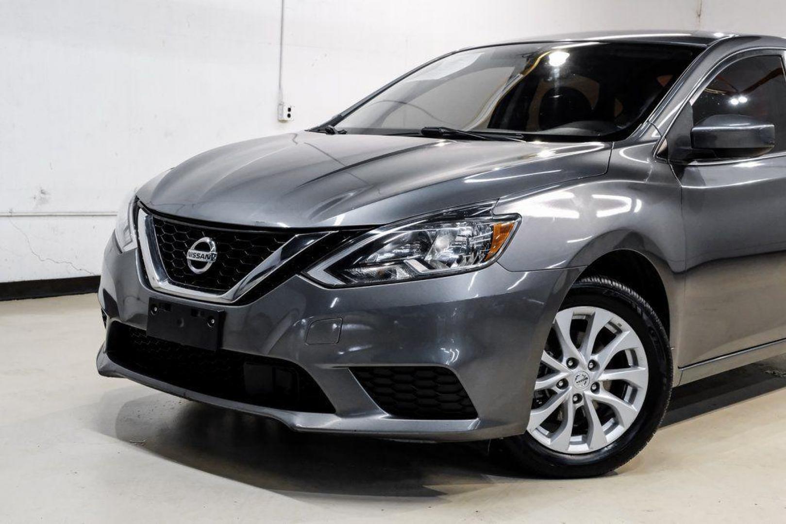 2019 Gun Metallic /Charcoal Nissan Sentra SV (3N1AB7AP4KL) with an 1.8L 4-Cylinder DOHC 16V engine, CVT transmission, located at 15300 Midway Rd., Addison, TX, 75001, (972) 702-0011, 32.958321, -96.838074 - 2019 Nissan Sentra SV<br><br>Now Available at Midway Auto Group, Addison, Texas<br><br>Comfortable, efficient, and packed with the 2019 Nissan Sentra SV is a step up from the base model, offering upgraded technology, refined interior features, and excellent fuel economy. With its spacious cabin and - Photo#4