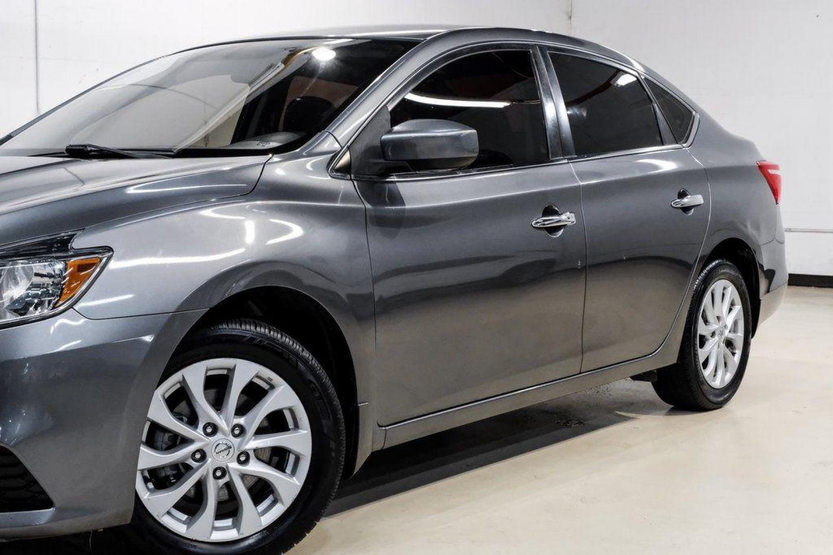 2019 Gun Metallic /Charcoal Nissan Sentra SV (3N1AB7AP4KL) with an 1.8L 4-Cylinder DOHC 16V engine, CVT transmission, located at 15300 Midway Rd., Addison, TX, 75001, (972) 702-0011, 32.958321, -96.838074 - 2019 Nissan Sentra SV<br><br>Now Available at Midway Auto Group, Addison, Texas<br><br>Comfortable, efficient, and packed with the 2019 Nissan Sentra SV is a step up from the base model, offering upgraded technology, refined interior features, and excellent fuel economy. With its spacious cabin and - Photo#5