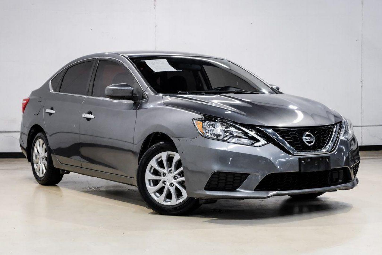 2019 Gun Metallic /Charcoal Nissan Sentra SV (3N1AB7AP4KL) with an 1.8L 4-Cylinder DOHC 16V engine, CVT transmission, located at 15300 Midway Rd., Addison, TX, 75001, (972) 702-0011, 32.958321, -96.838074 - 2019 Nissan Sentra SV<br><br>Now Available at Midway Auto Group, Addison, Texas<br><br>Comfortable, efficient, and packed with the 2019 Nissan Sentra SV is a step up from the base model, offering upgraded technology, refined interior features, and excellent fuel economy. With its spacious cabin and - Photo#7