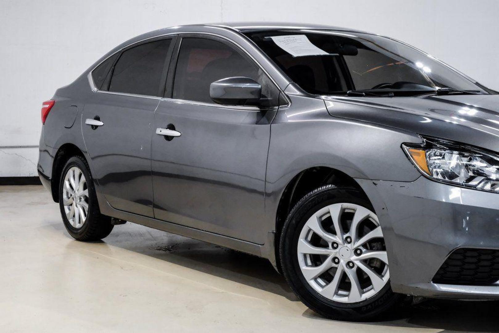 2019 Gun Metallic /Charcoal Nissan Sentra SV (3N1AB7AP4KL) with an 1.8L 4-Cylinder DOHC 16V engine, CVT transmission, located at 15300 Midway Rd., Addison, TX, 75001, (972) 702-0011, 32.958321, -96.838074 - 2019 Nissan Sentra SV<br><br>Now Available at Midway Auto Group, Addison, Texas<br><br>Comfortable, efficient, and packed with the 2019 Nissan Sentra SV is a step up from the base model, offering upgraded technology, refined interior features, and excellent fuel economy. With its spacious cabin and - Photo#8
