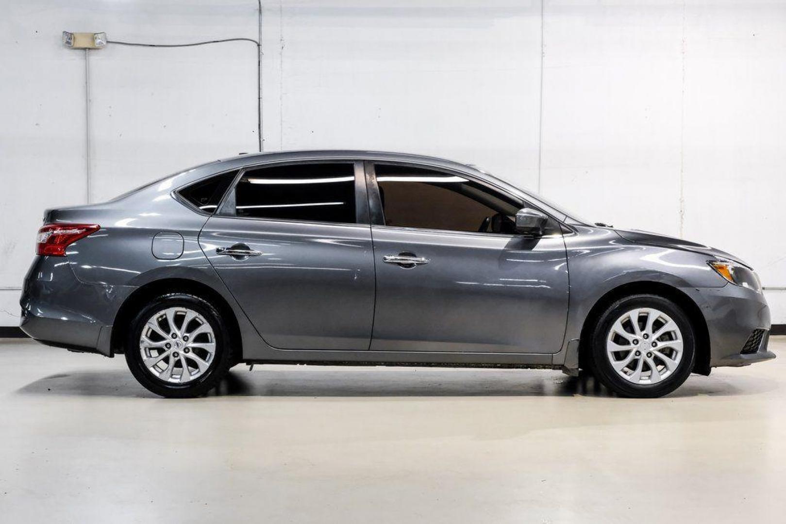 2019 Gun Metallic /Charcoal Nissan Sentra SV (3N1AB7AP4KL) with an 1.8L 4-Cylinder DOHC 16V engine, CVT transmission, located at 15300 Midway Rd., Addison, TX, 75001, (972) 702-0011, 32.958321, -96.838074 - 2019 Nissan Sentra SV<br><br>Now Available at Midway Auto Group, Addison, Texas<br><br>Comfortable, efficient, and packed with the 2019 Nissan Sentra SV is a step up from the base model, offering upgraded technology, refined interior features, and excellent fuel economy. With its spacious cabin and - Photo#10