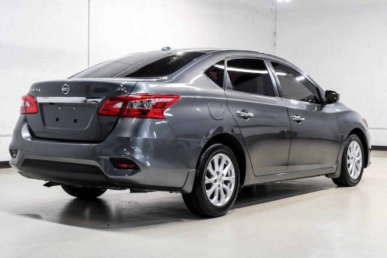 2019 Gun Metallic /Charcoal Nissan Sentra SV (3N1AB7AP4KL) with an 1.8L 4-Cylinder DOHC 16V engine, CVT transmission, located at 15300 Midway Rd., Addison, TX, 75001, (972) 702-0011, 32.958321, -96.838074 - 2019 Nissan Sentra SV<br><br>Now Available at Midway Auto Group, Addison, Texas<br><br>Comfortable, efficient, and packed with the 2019 Nissan Sentra SV is a step up from the base model, offering upgraded technology, refined interior features, and excellent fuel economy. With its spacious cabin and - Photo#11